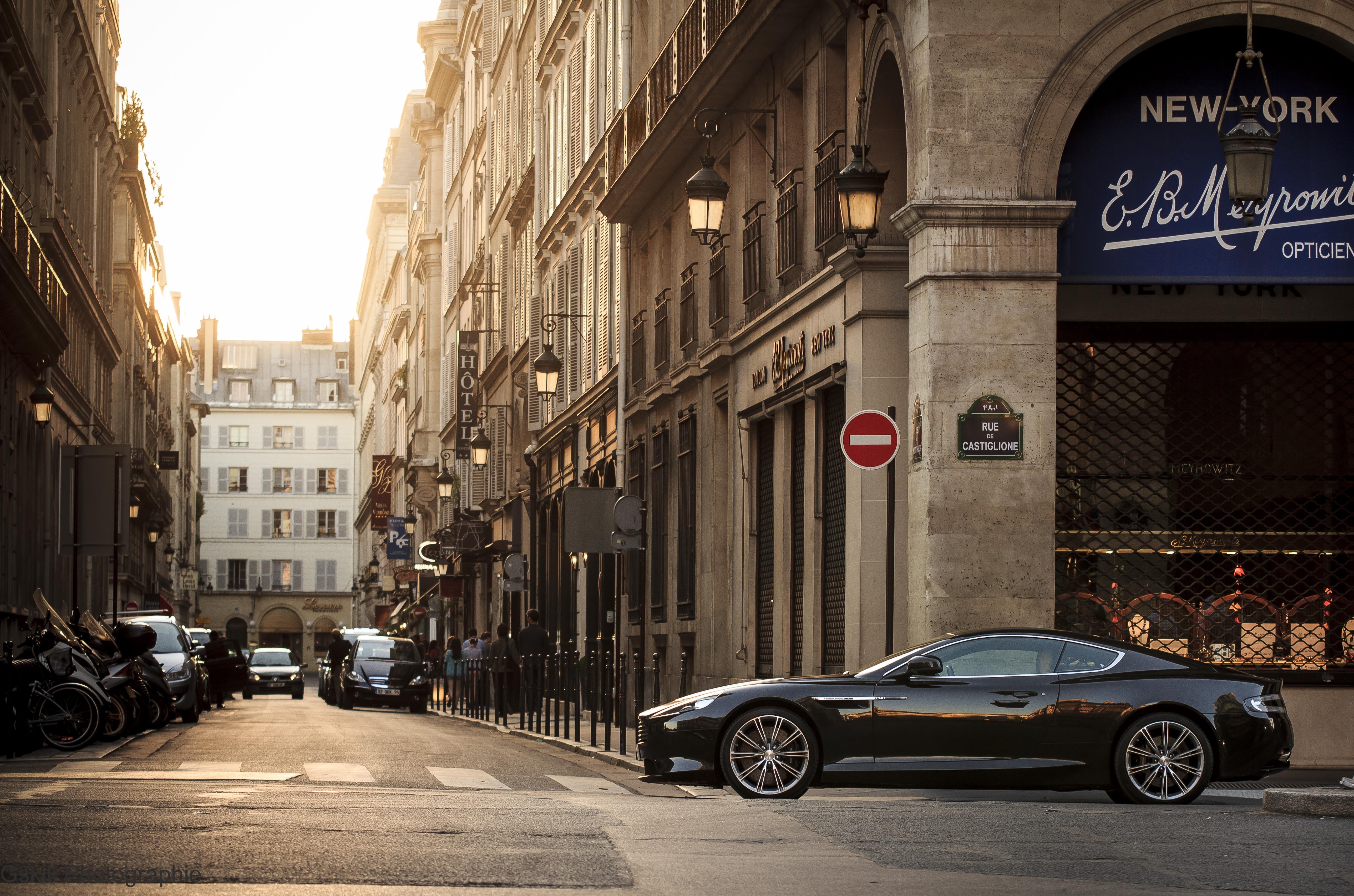 black coupe, Aston Martin, street, building, Turn, side view
