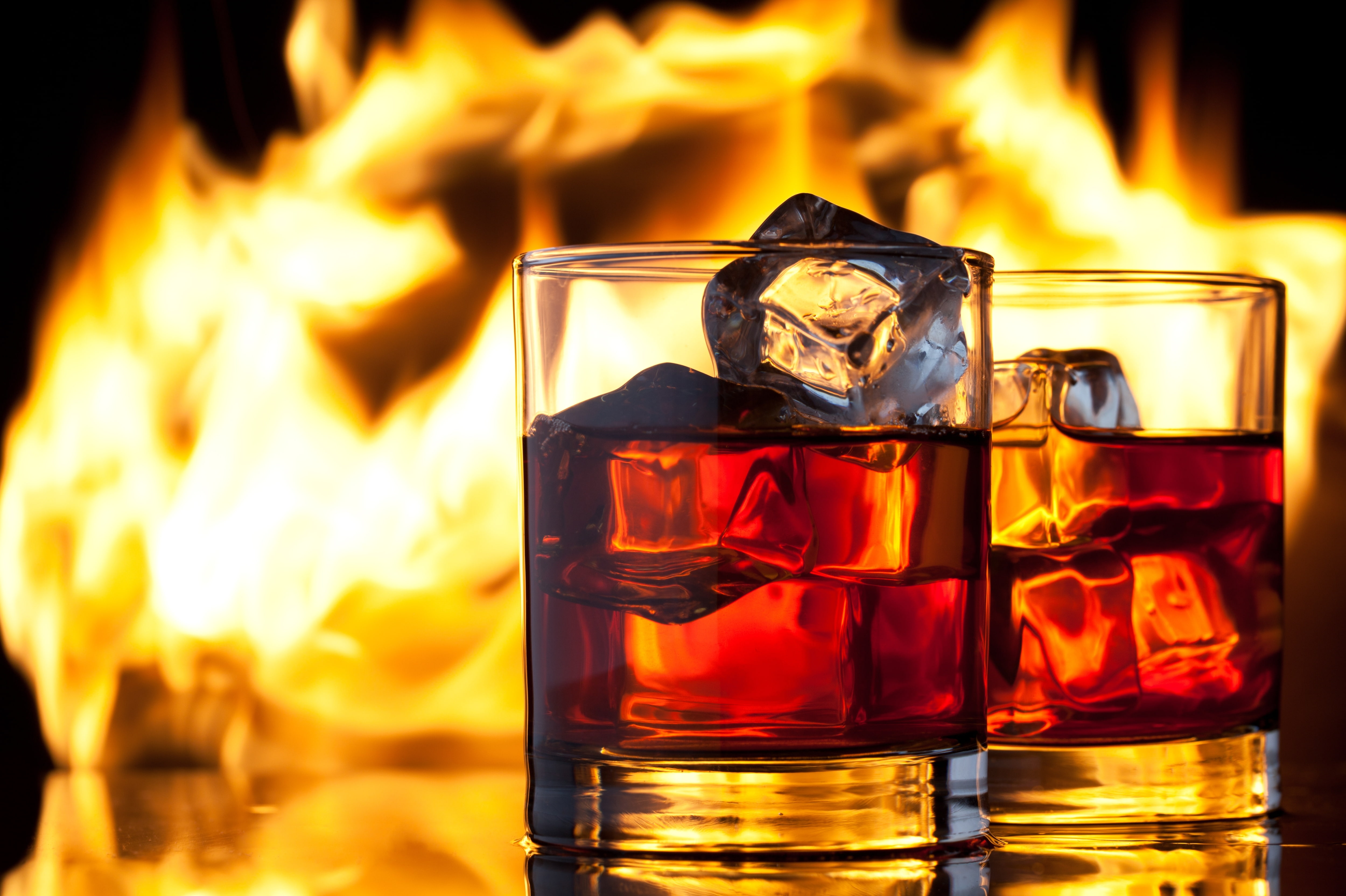 two clear drinking glasses, ice, fire, flame, whiskey, fire - Natural Phenomenon