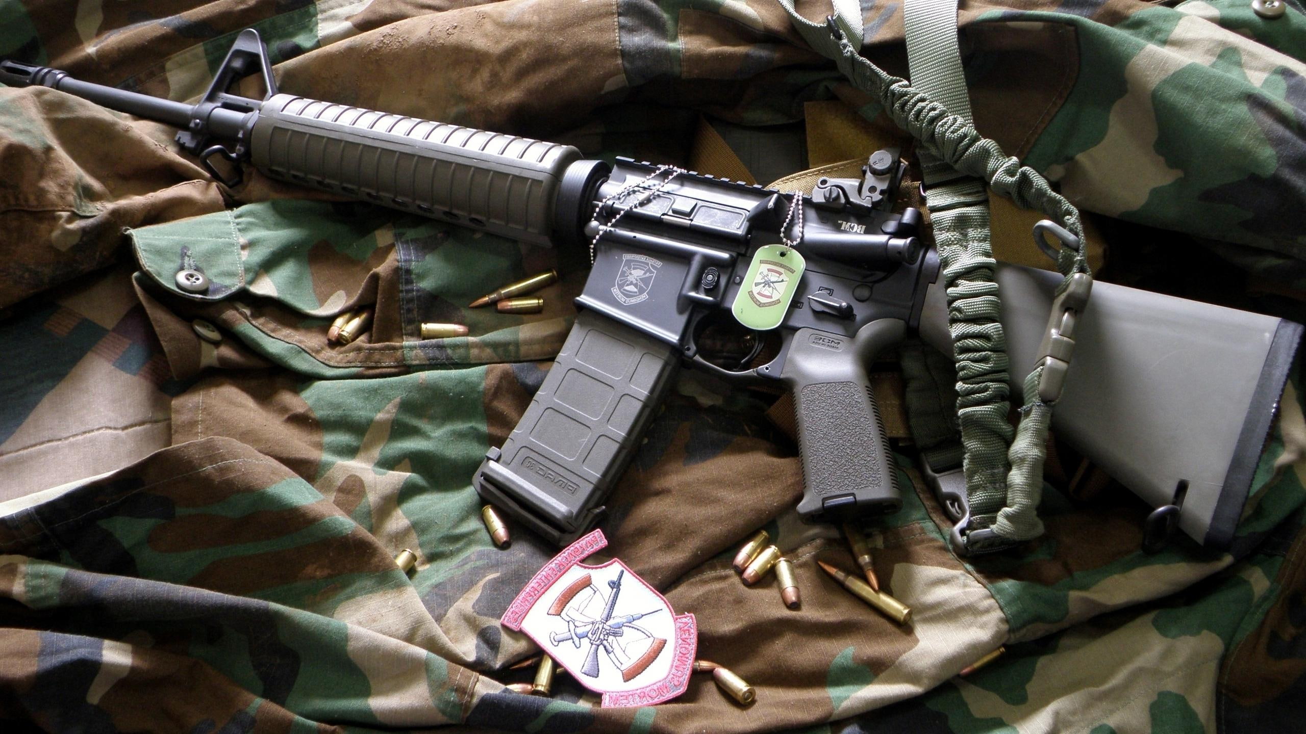 British SA-80 rifle from 1996, black and gray rifle and bullets