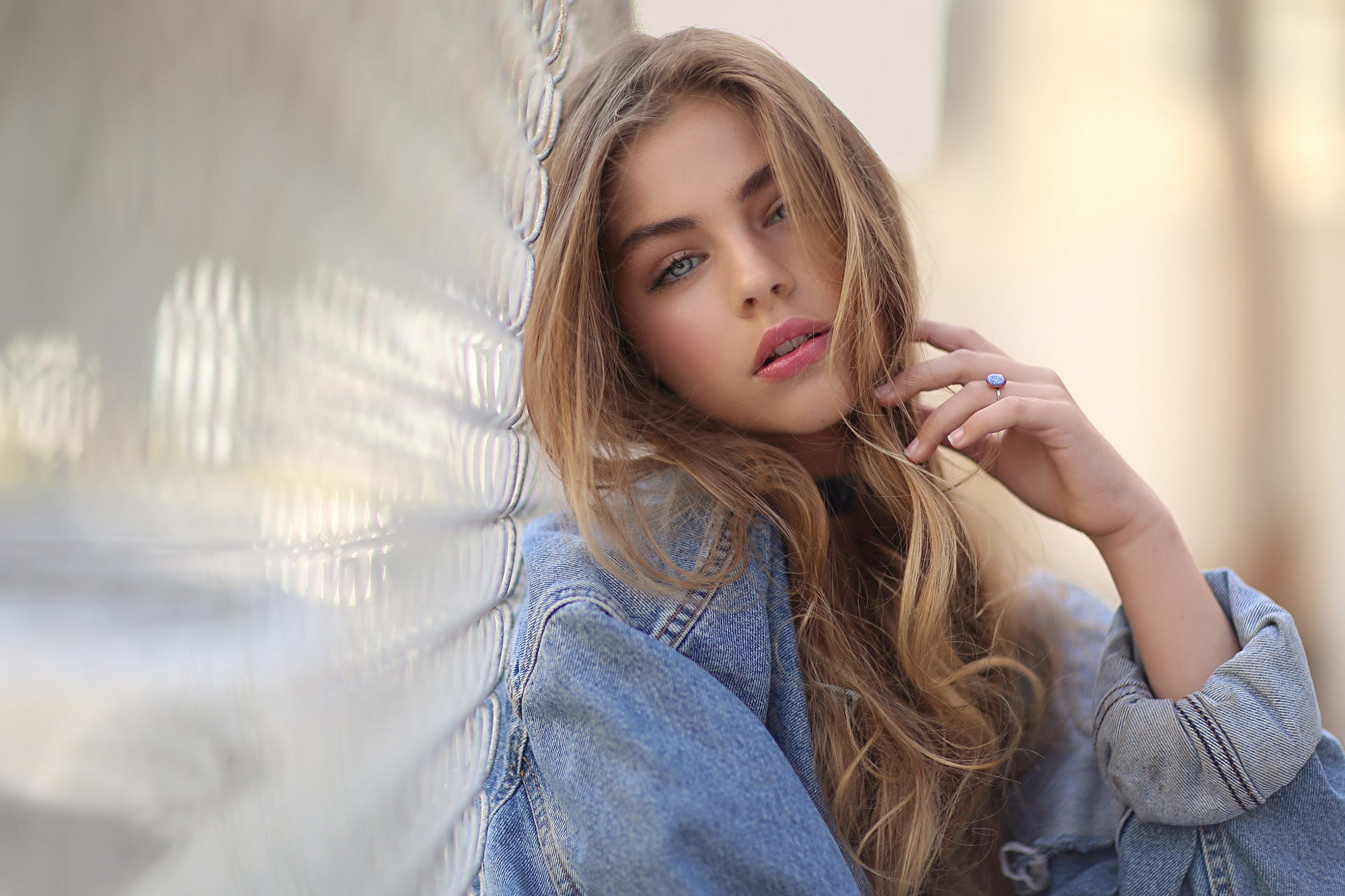 open mouth, portrait, hair in face, blonde, fence, pink lipstick