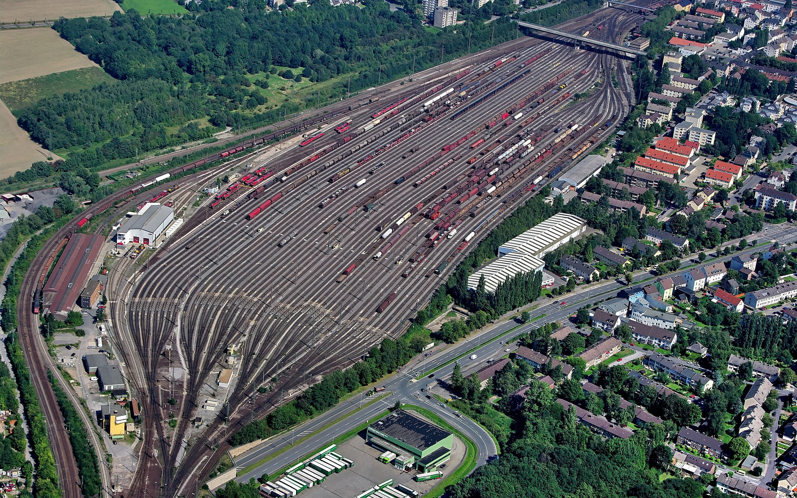 asphalt road, train, rail yard, city, aerial view, high angle view