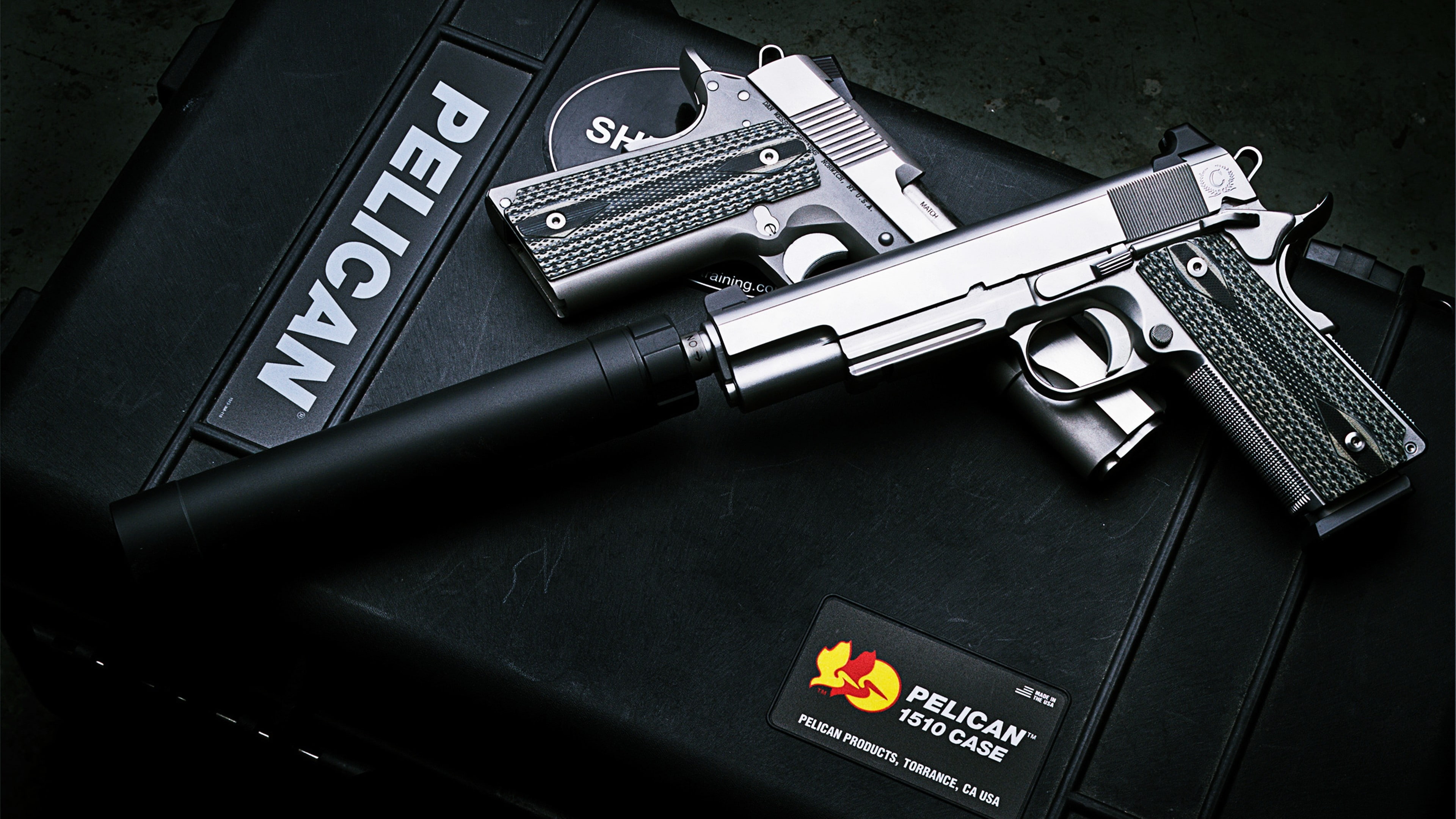 photo of Pelican 1510 pistol, Dan Wesson M1911, ACP pistol, silencer