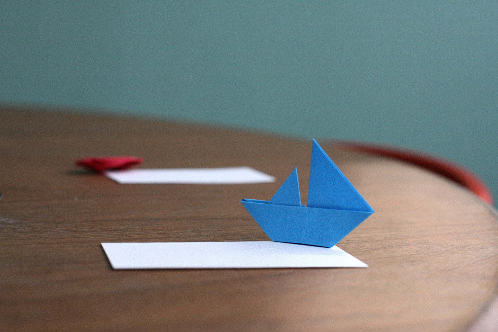 blue boat paper origami decor, minimalism, sailing ship, macro