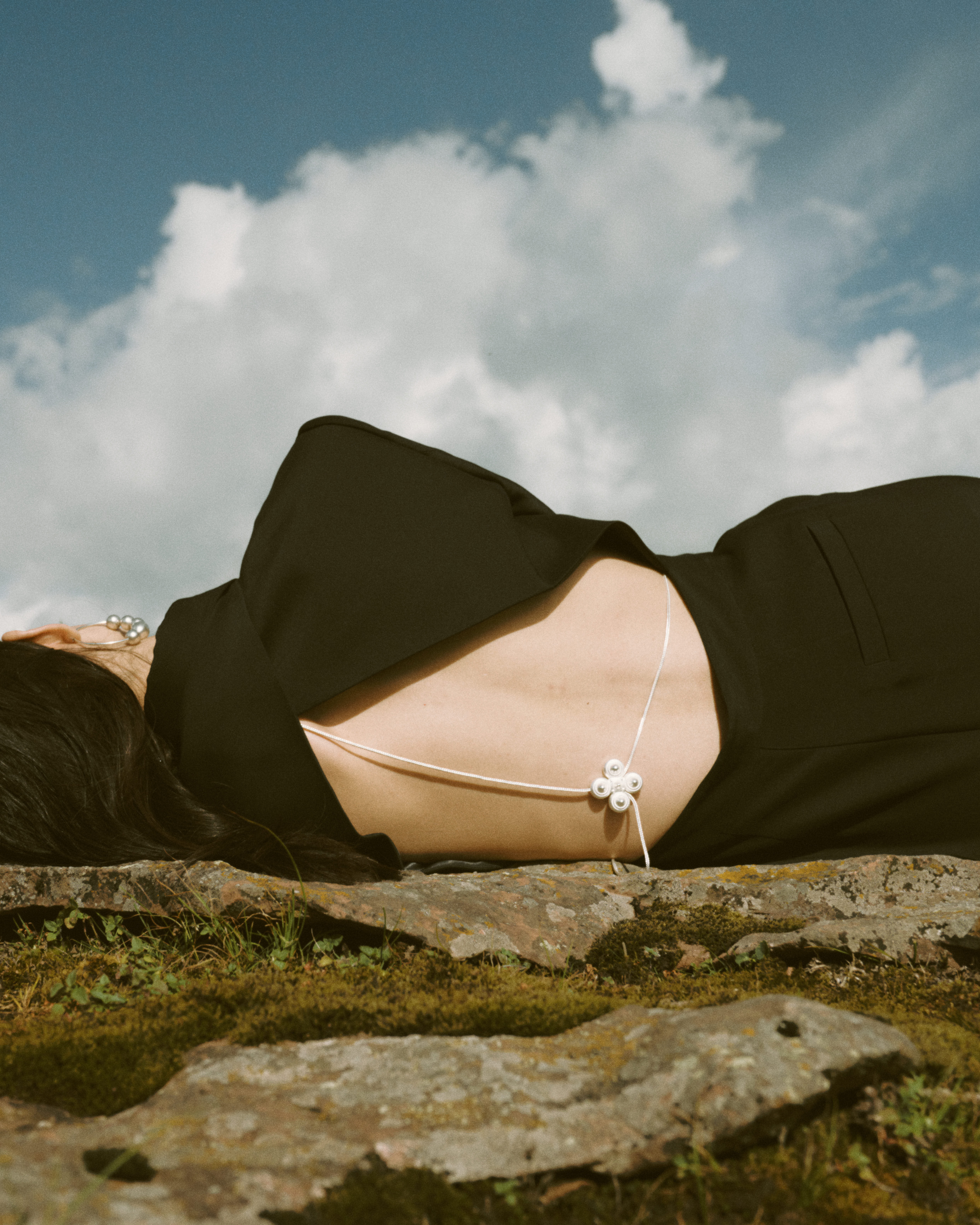 back, lying on side, sky