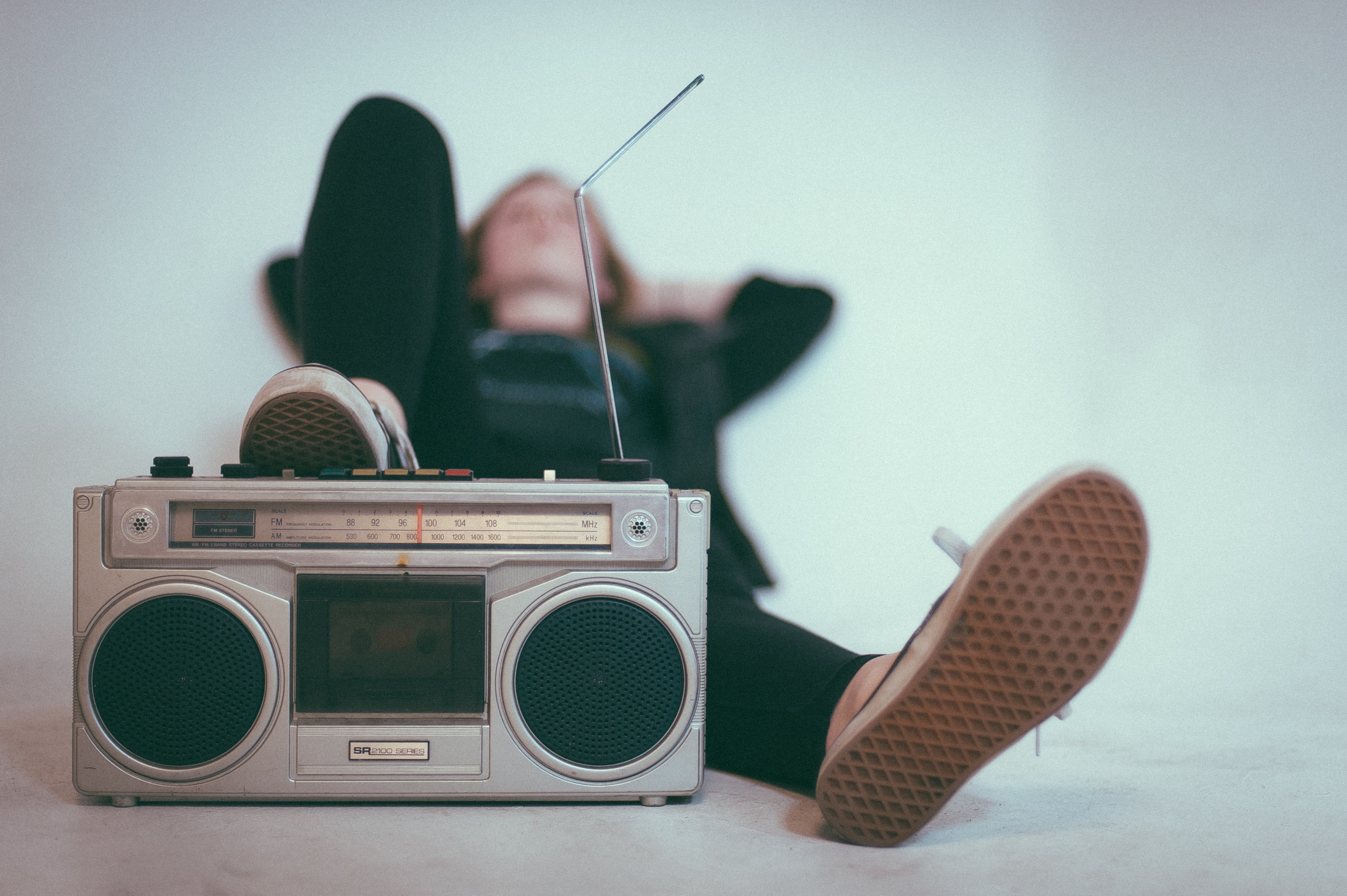 black and gray radio player, photography, lying down, music, technology