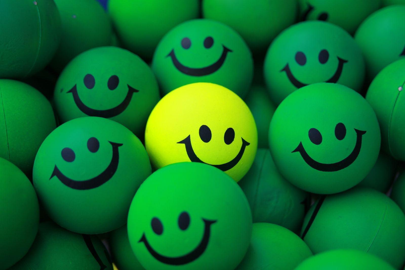 green and yellow smiley emoji, balls, fun