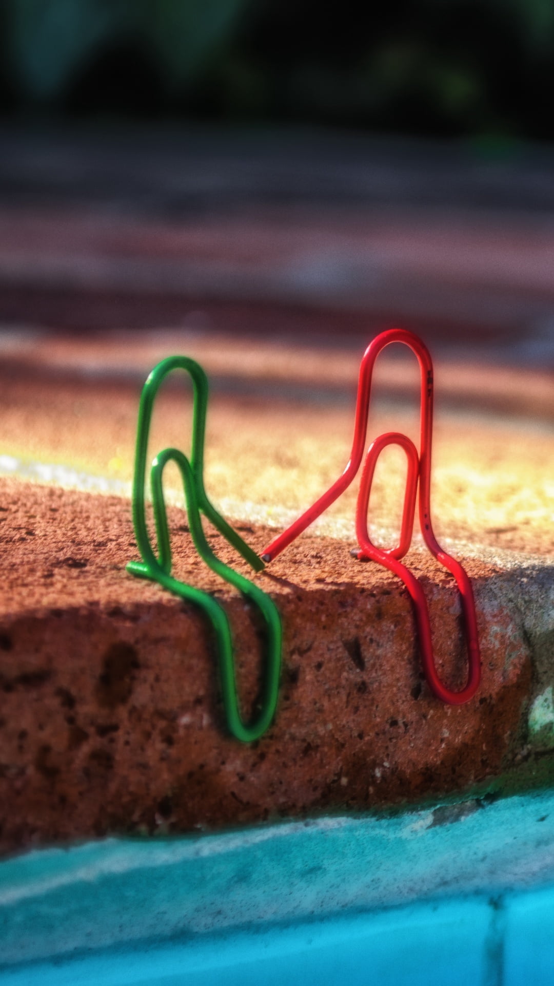 Staples Couple, two green and red paper clips, Love, close-up