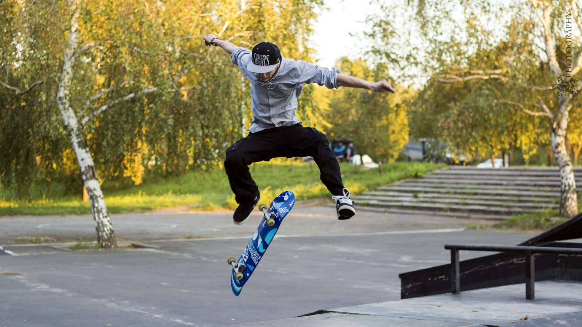Skateboard kickflip, selective photograph of skater boy jumping