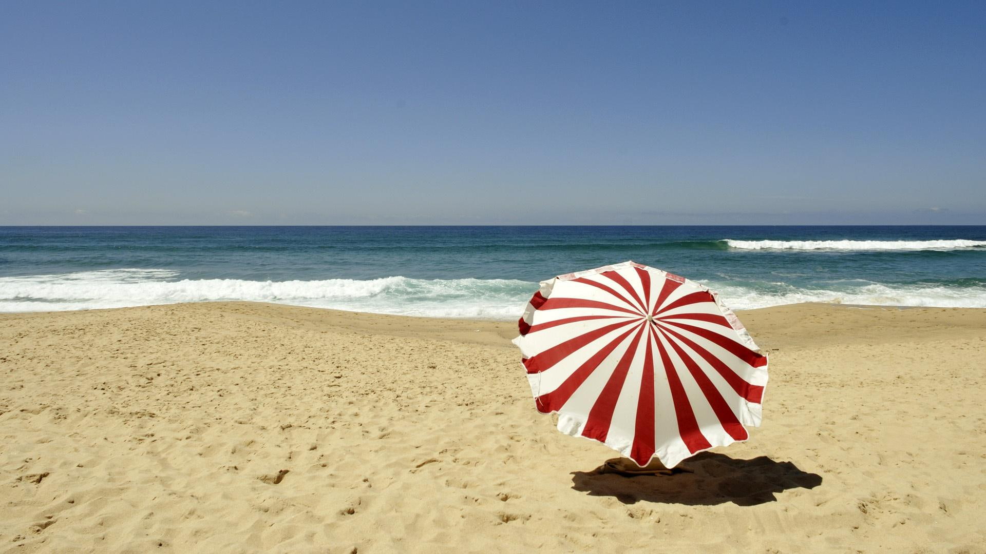Red and white umbrella on the beach, red and white umbrella, beaches