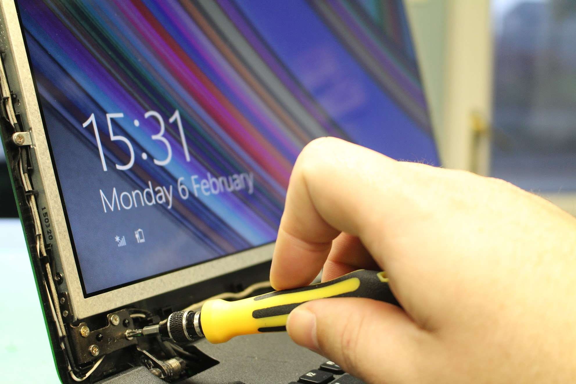 laptop, laptop screen, repairs, replacement, screwdriver, human hand