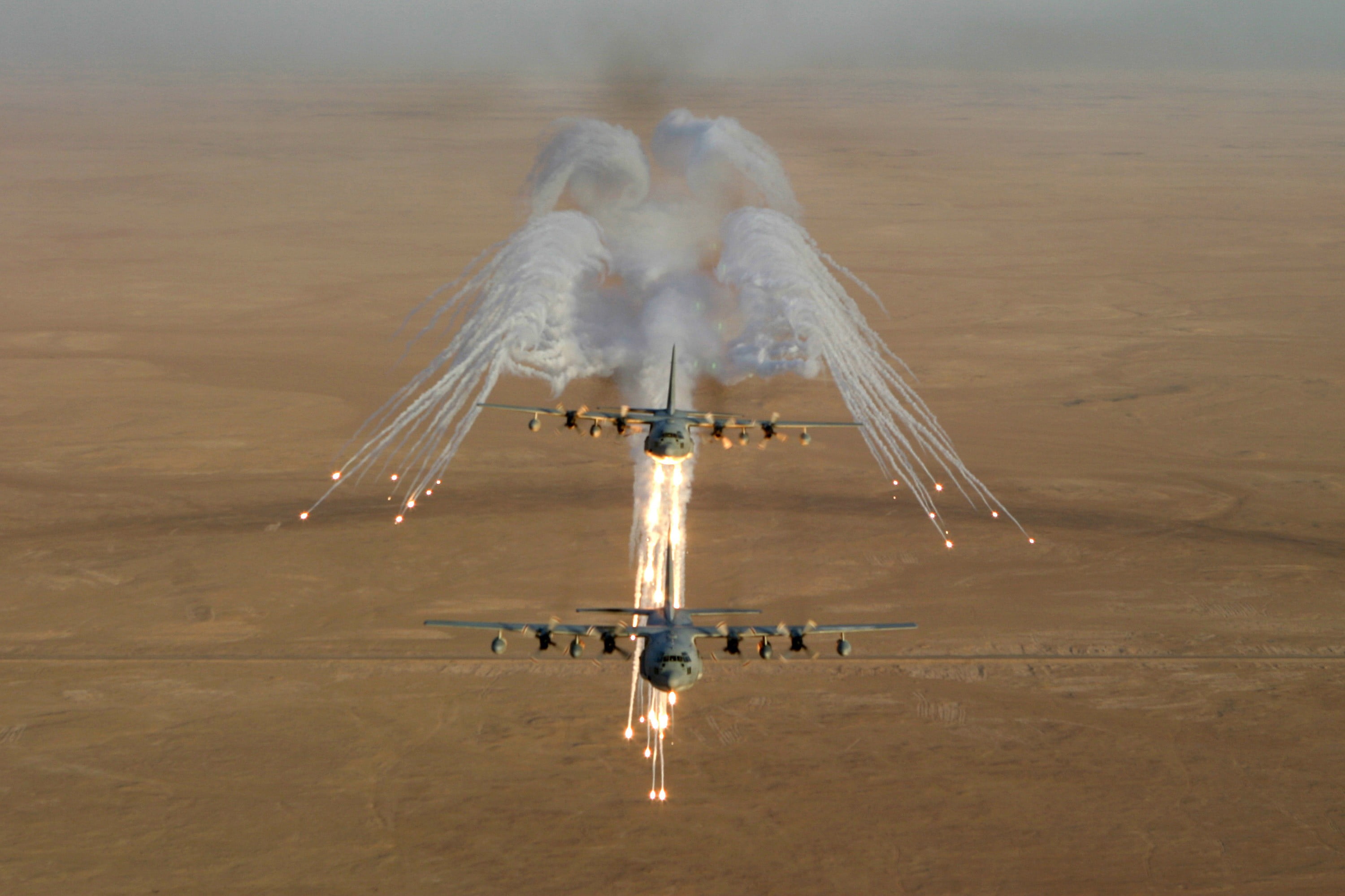 two airplanes, flares, Lockheed C-130 Hercules, military, motion