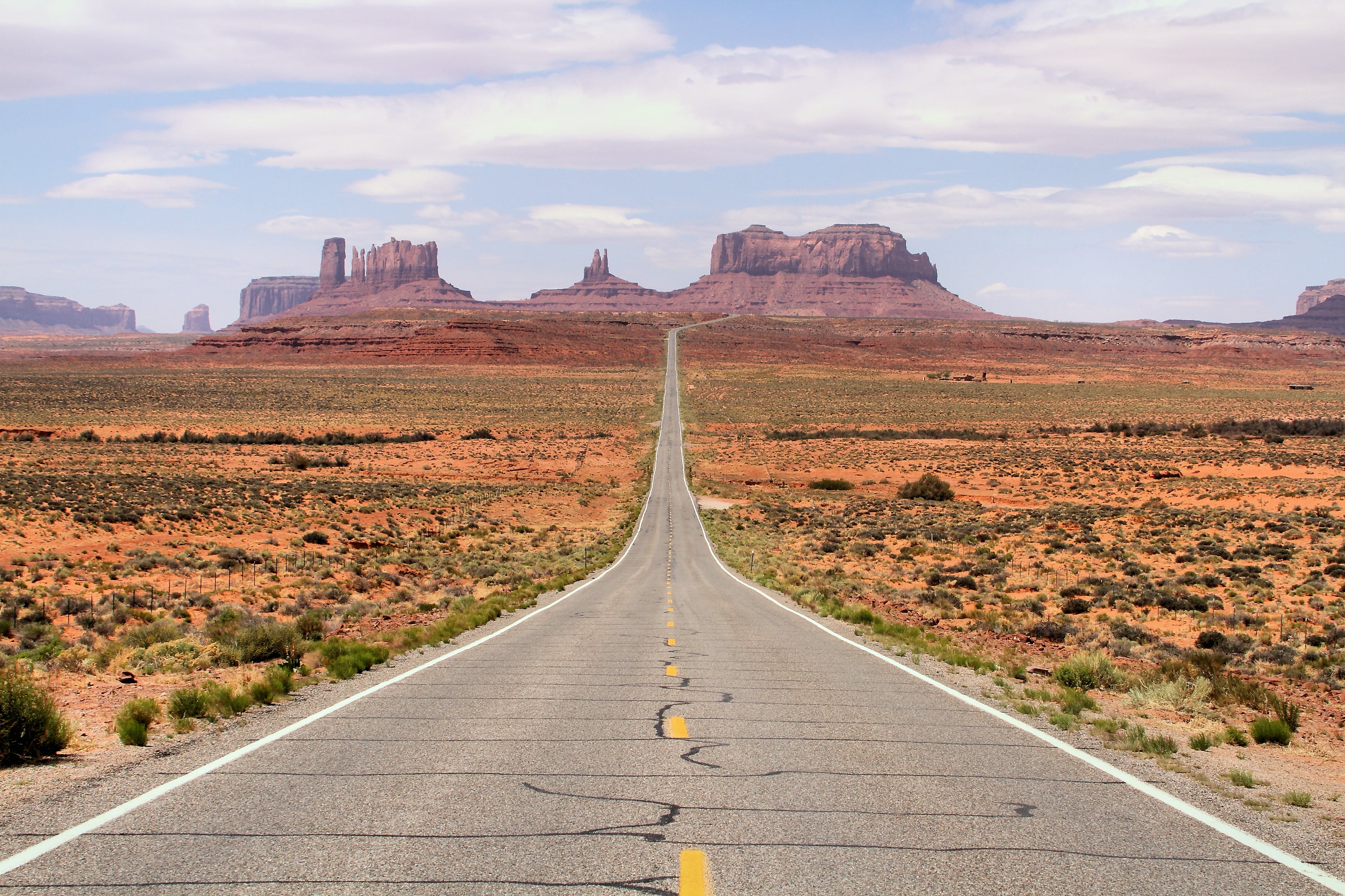 gray asphalt road during daytime, Monument Valley, Honeymoon