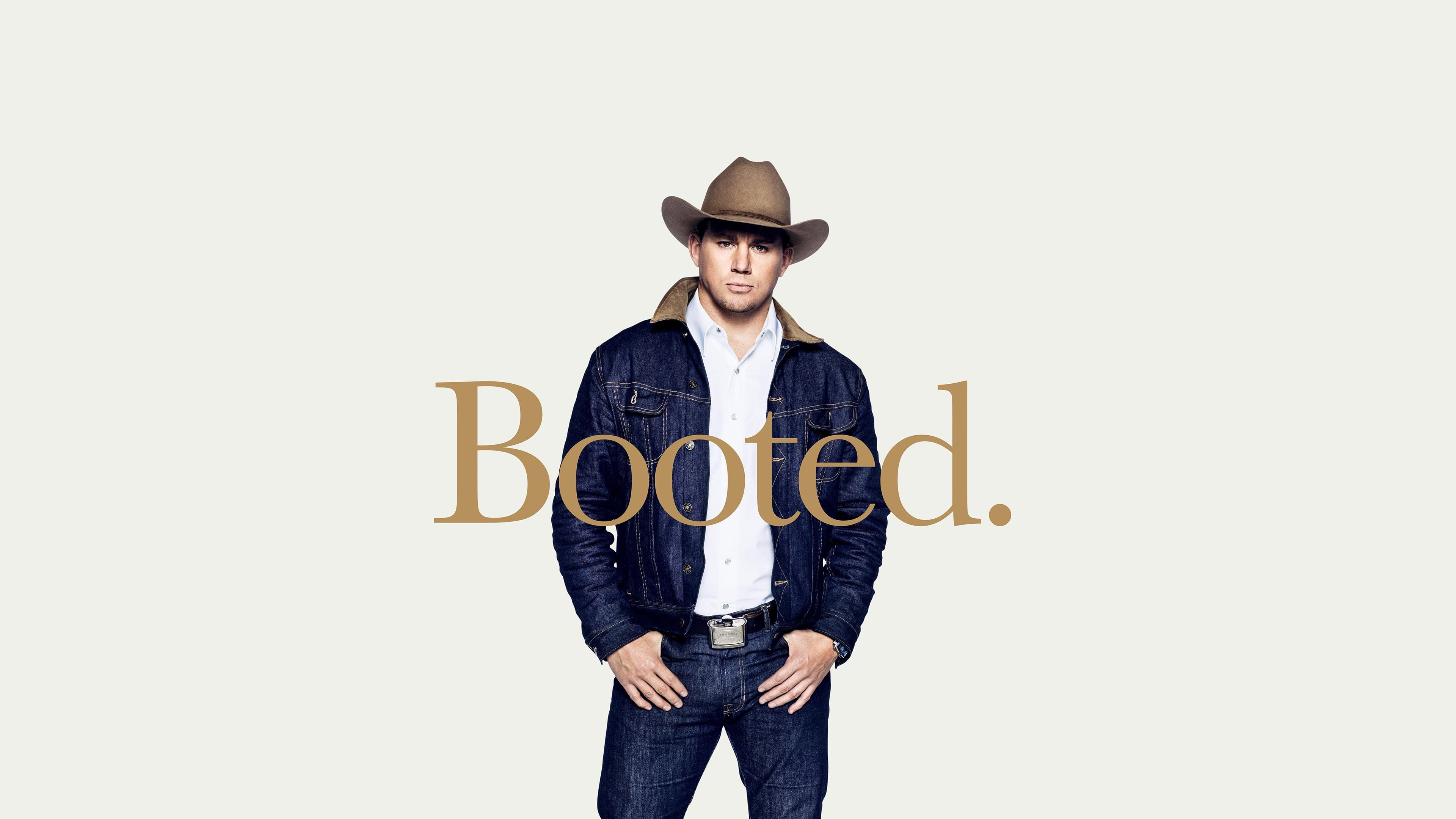 man in blue denim jacket and blue jeans wearing brown cowboy hat with booted text overlay