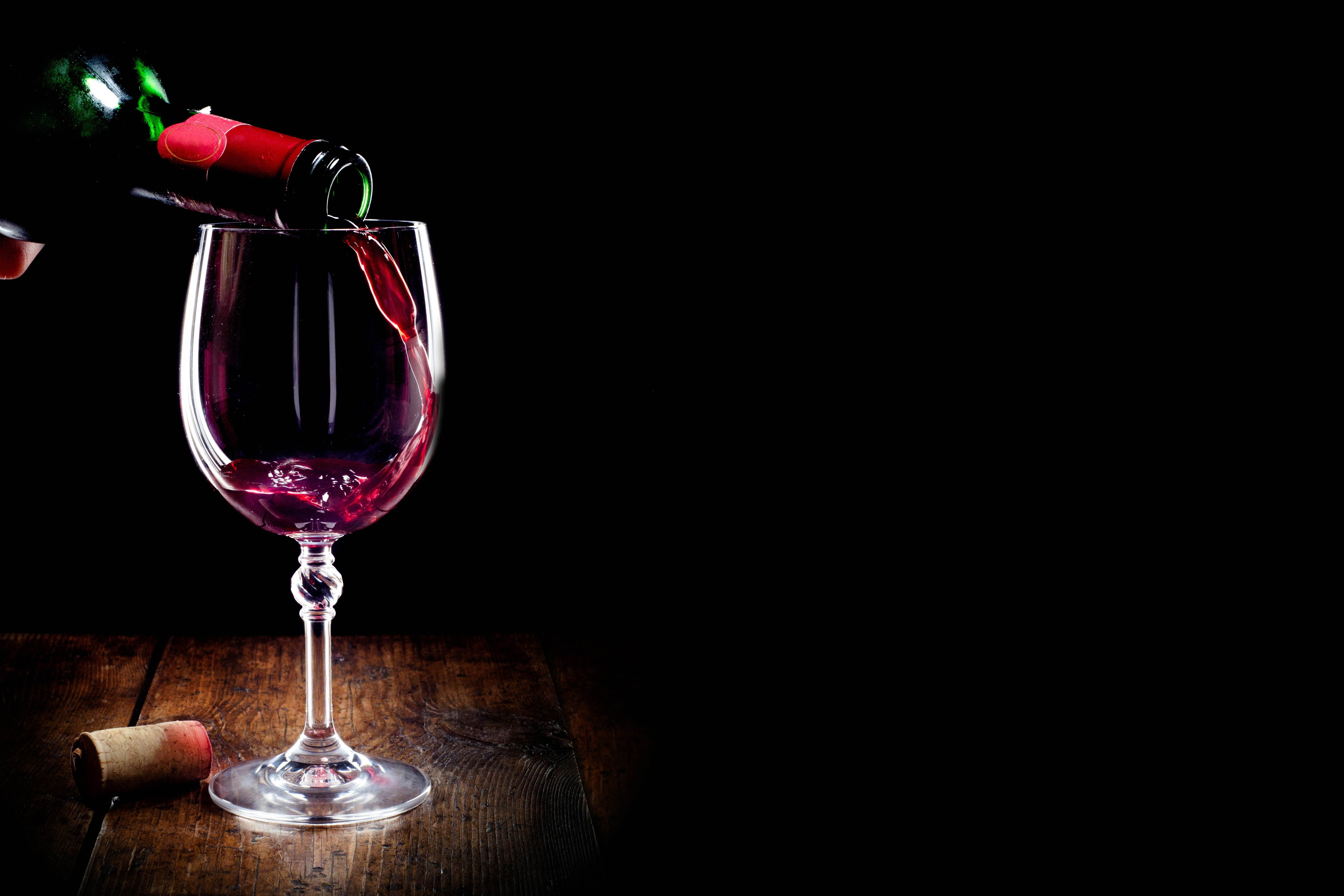 clear wine glass, red, bottle, tube, black background, alcohol