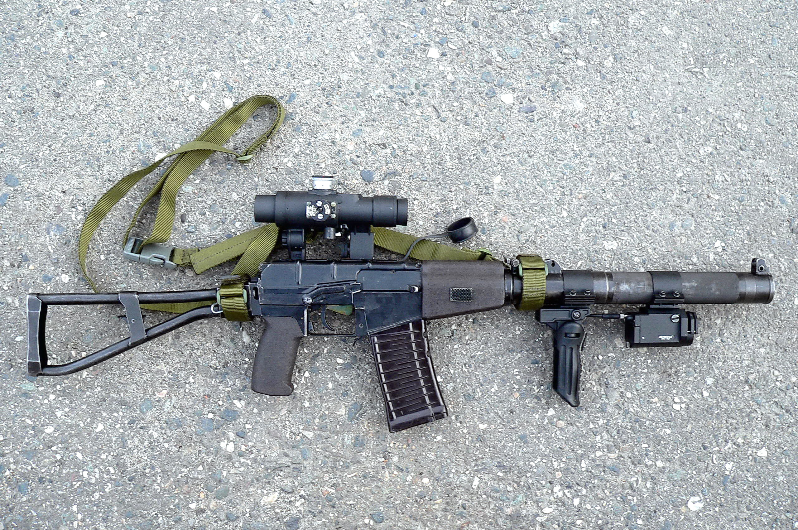 black rifle with scope, asphalt, weapons, cartridge, strap, Machine