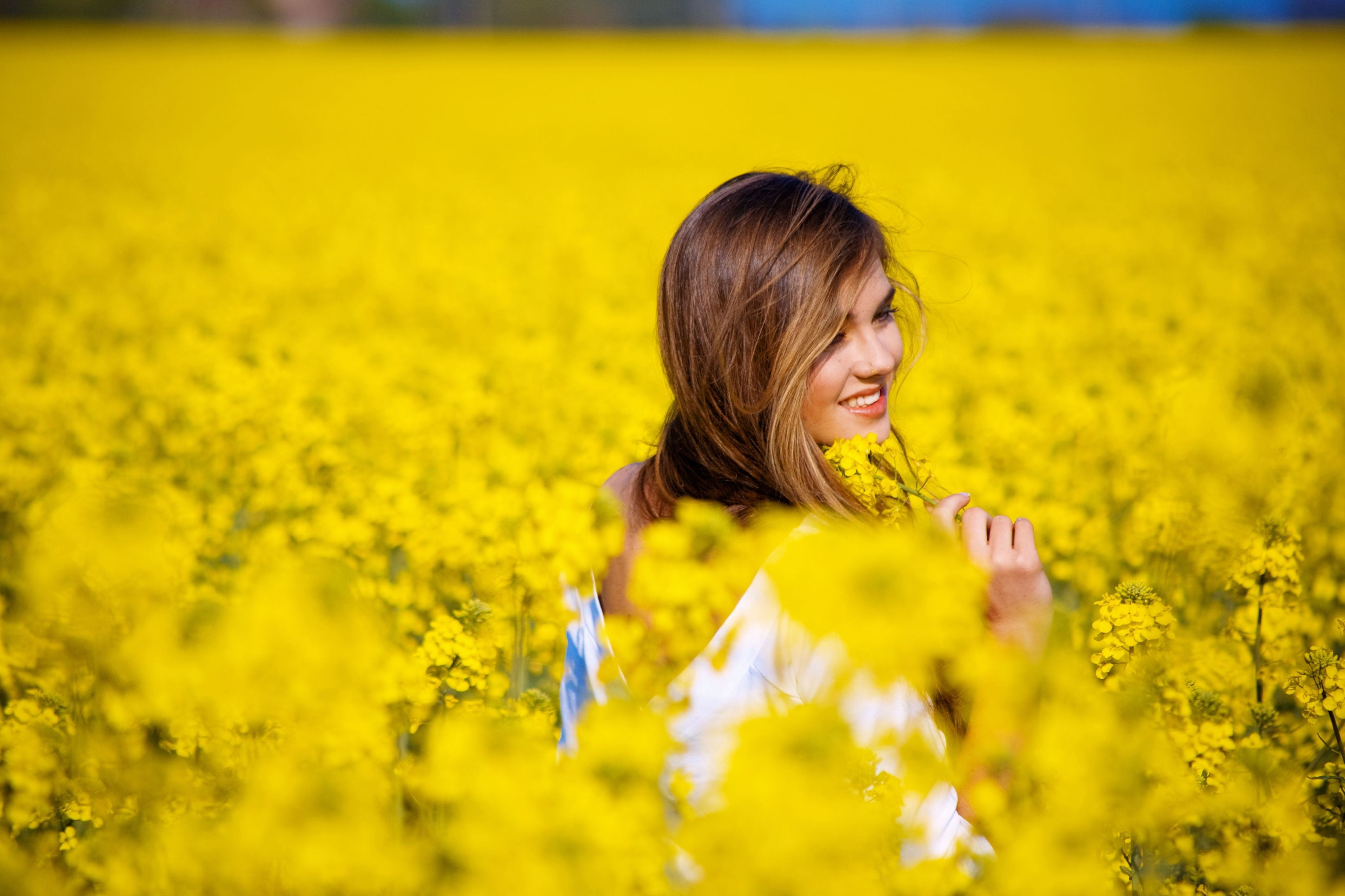 women's white scoop-neck shirt, field, girl, flowers, smile, background