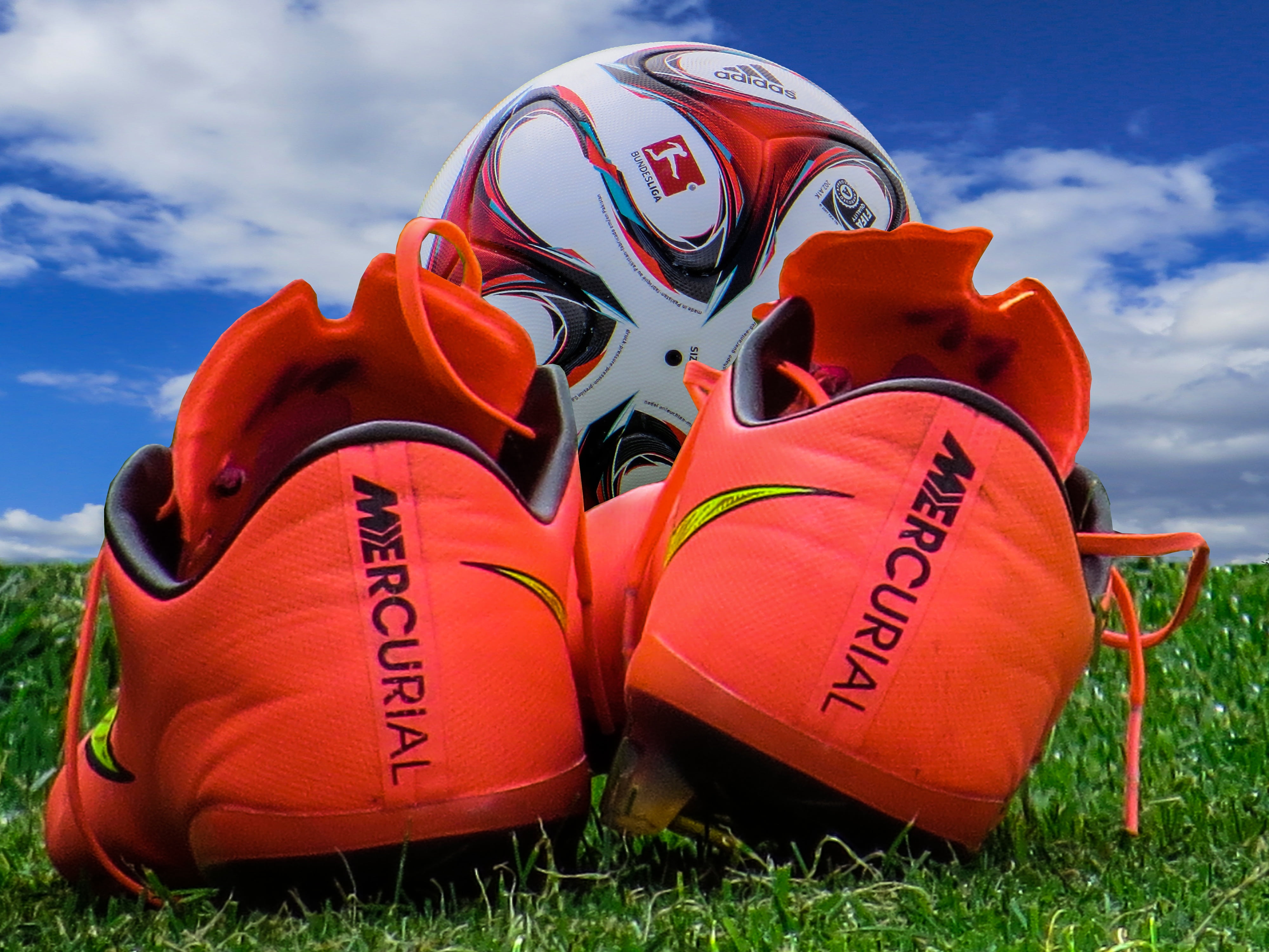 pair of orange Mercury cleats, football, shoe, sport, outdoors