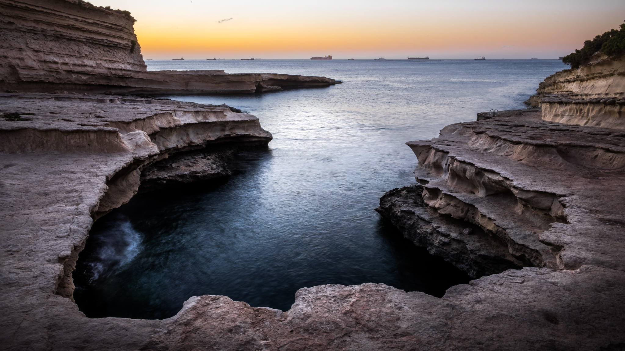 brown rock formation near body of water, malta, malta, St Peter's pool