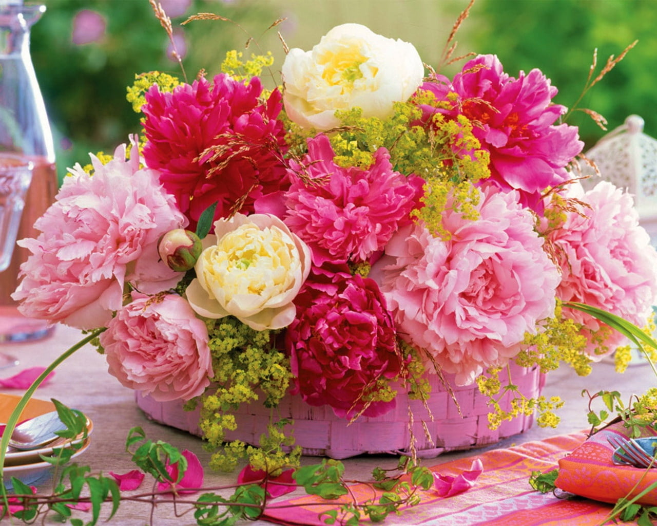 assorted-type of flowers in pink woven basket, peonies, table