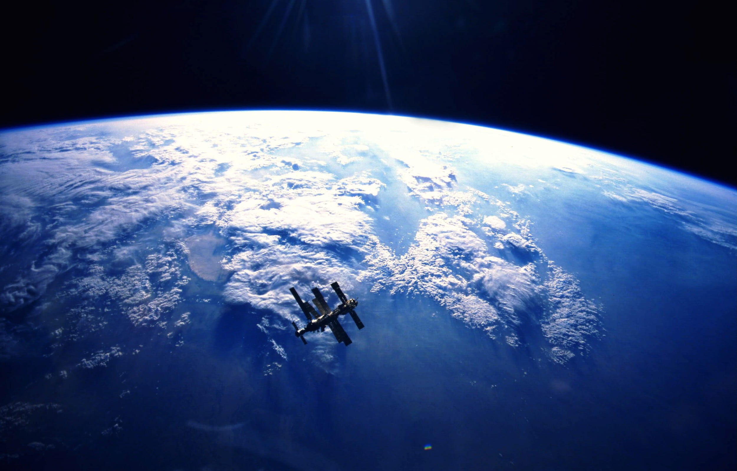 Mir In Orbit High Above The Earth, brown space ship, 3D, blue