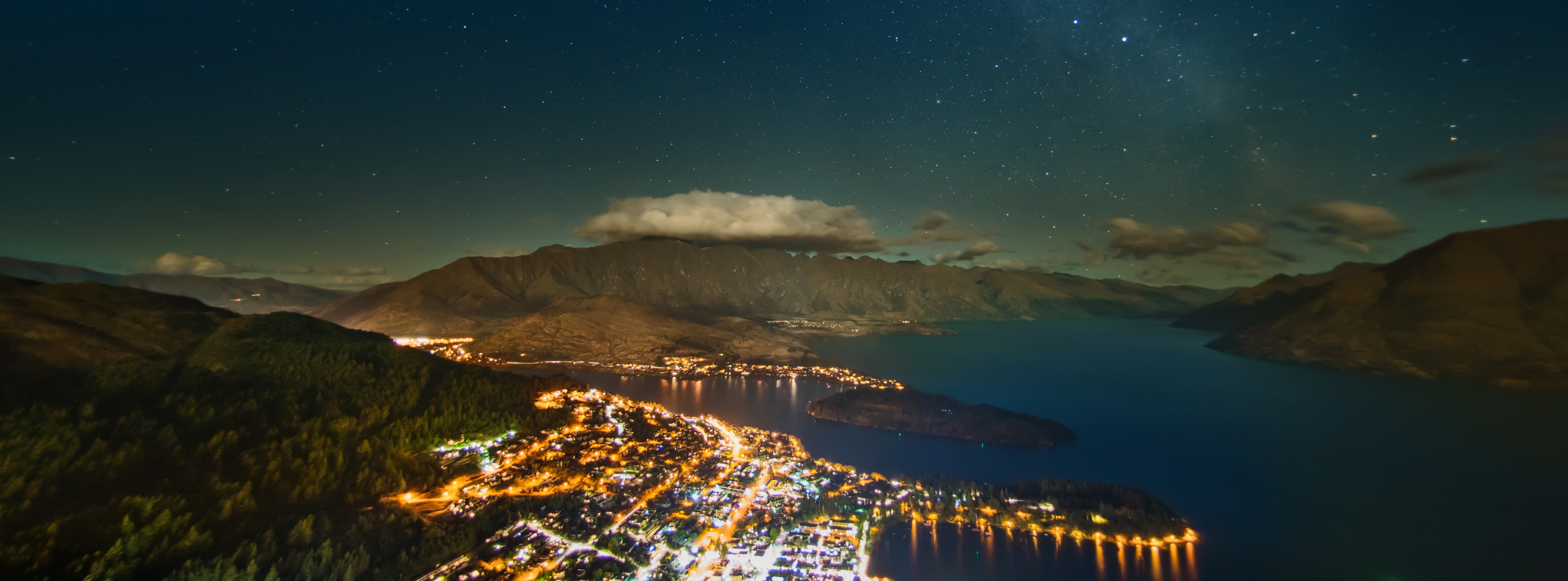 The Milky Way over Queenstown, blue water, Oceania, New Zealand