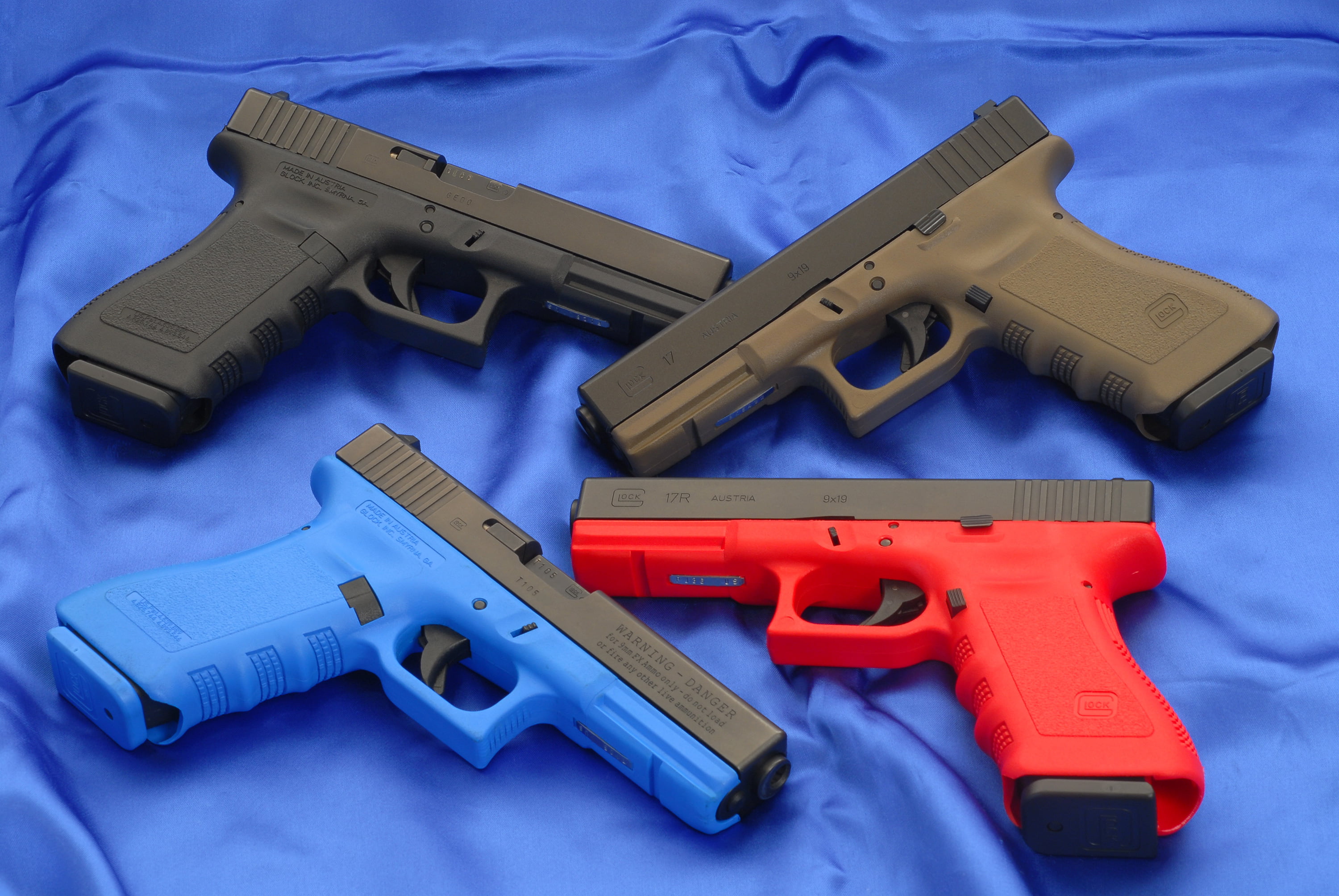 four assorted-color semi-automatic pistols, Wallpaper, Trunks