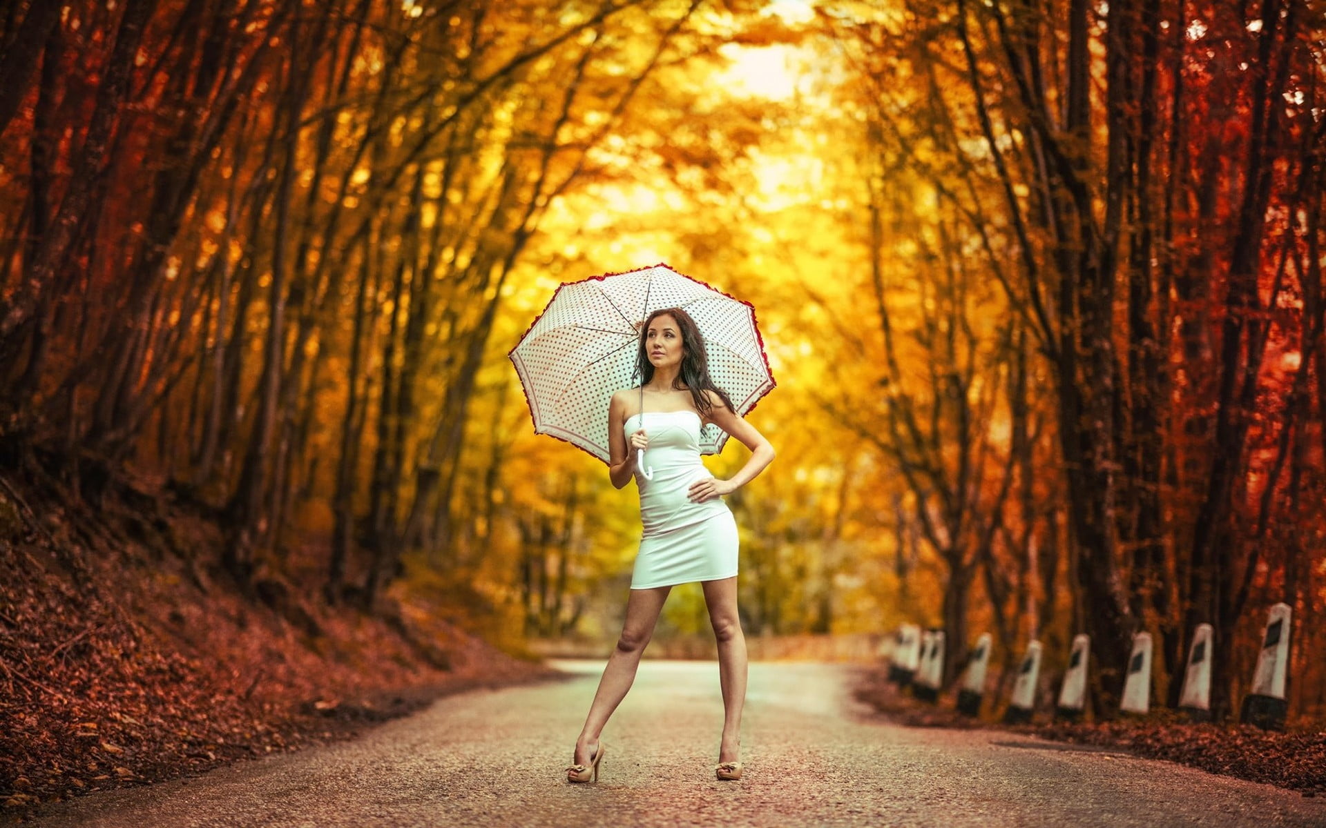 women's white strapless minidress, woman holding white umbrella