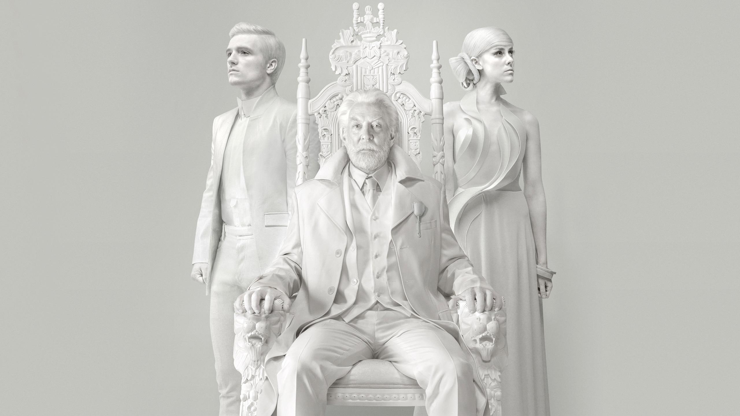 Josh, Donald Jena Malone In The Hunger Game, man sitting on chair between man and woman