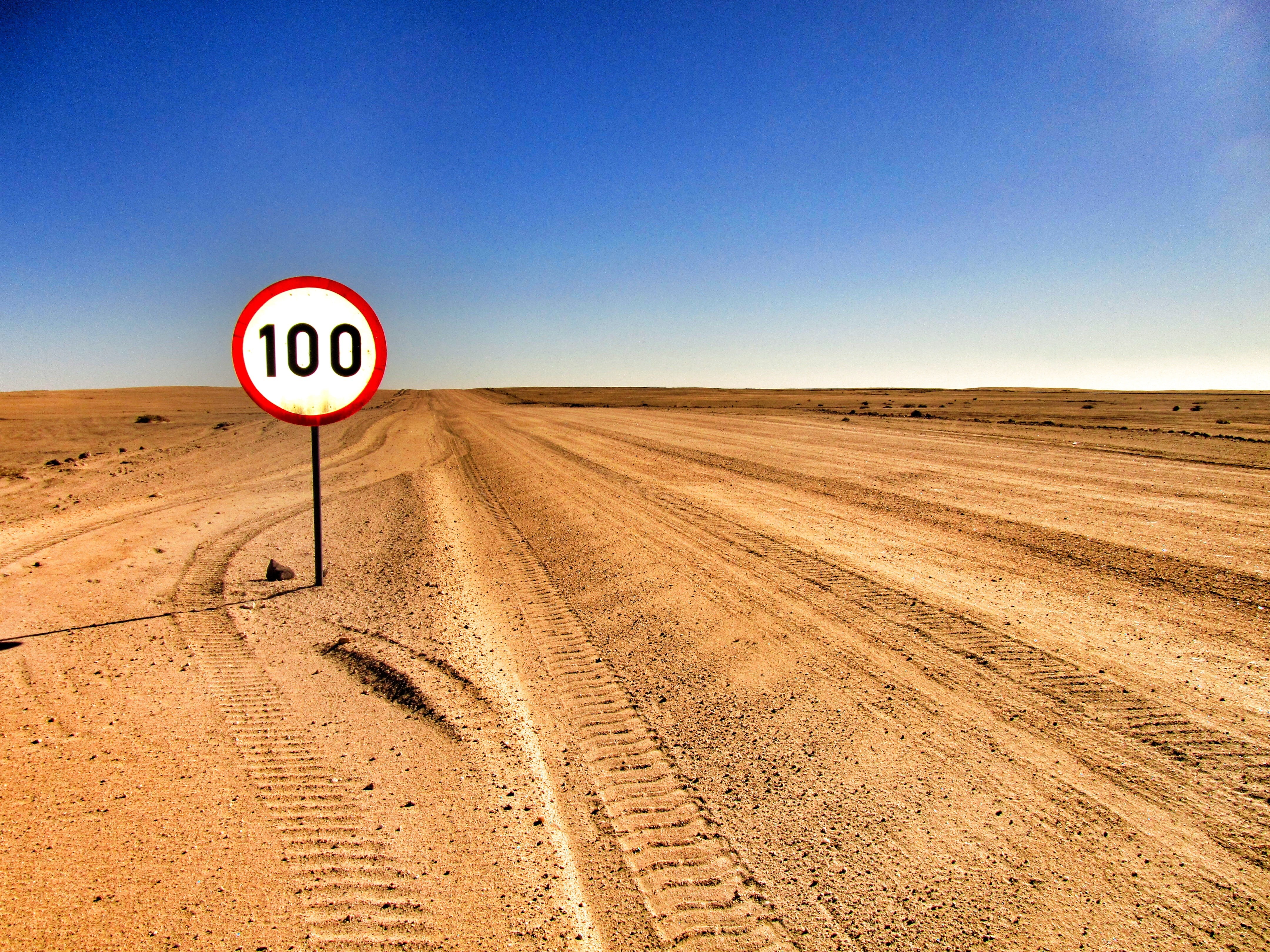 sky, sign, signboard, road, road sign, landscape, desert, nature