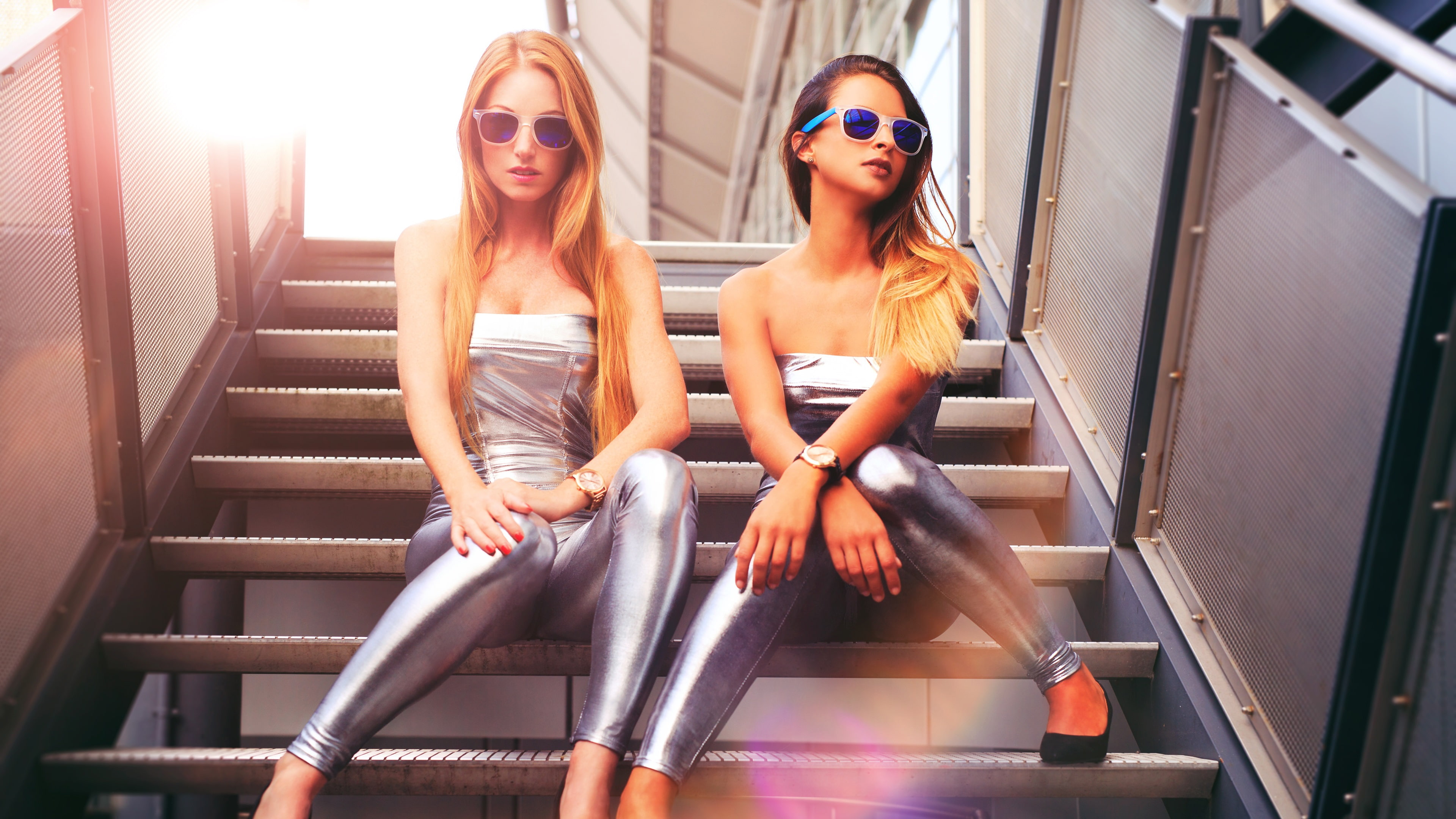 Silver dress girls sit at stairs, glasses, blonde