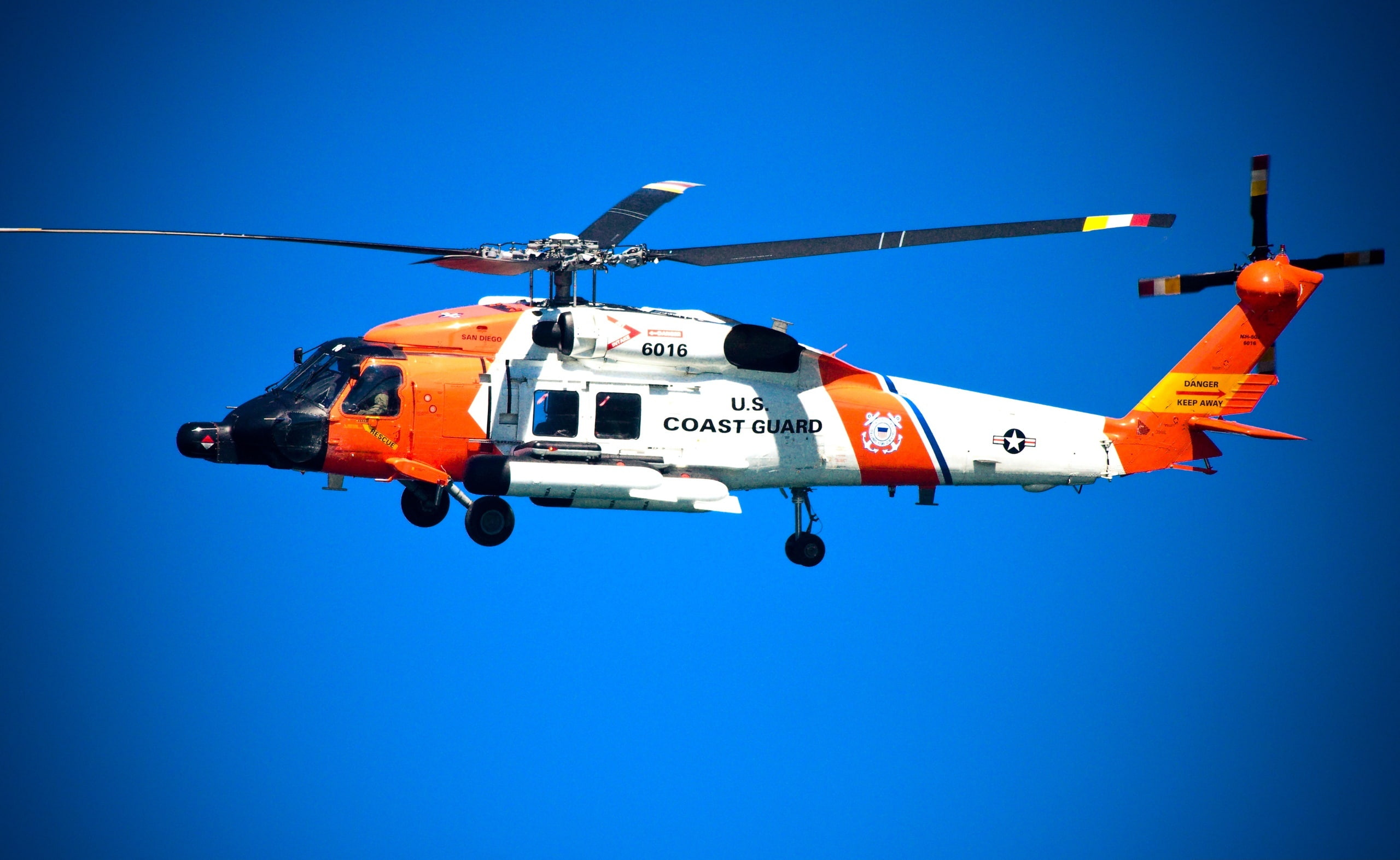 US Coast Guard Helicopter, white and orange Coast Guard helicopter