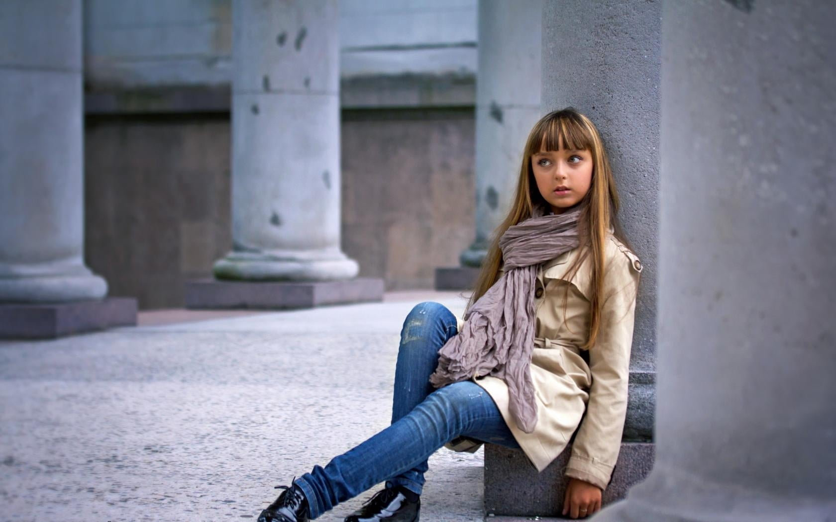 women's beige leather coat, gray scarf, blue denim fitted jeans, and pair of black leather shoes outfit