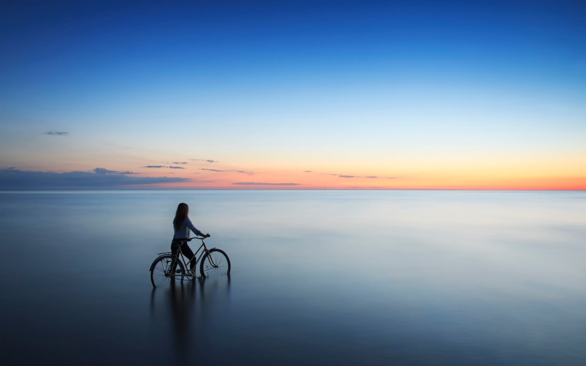 women outdoors, sea, bicycle, Latvia, sunset, sky, horizon