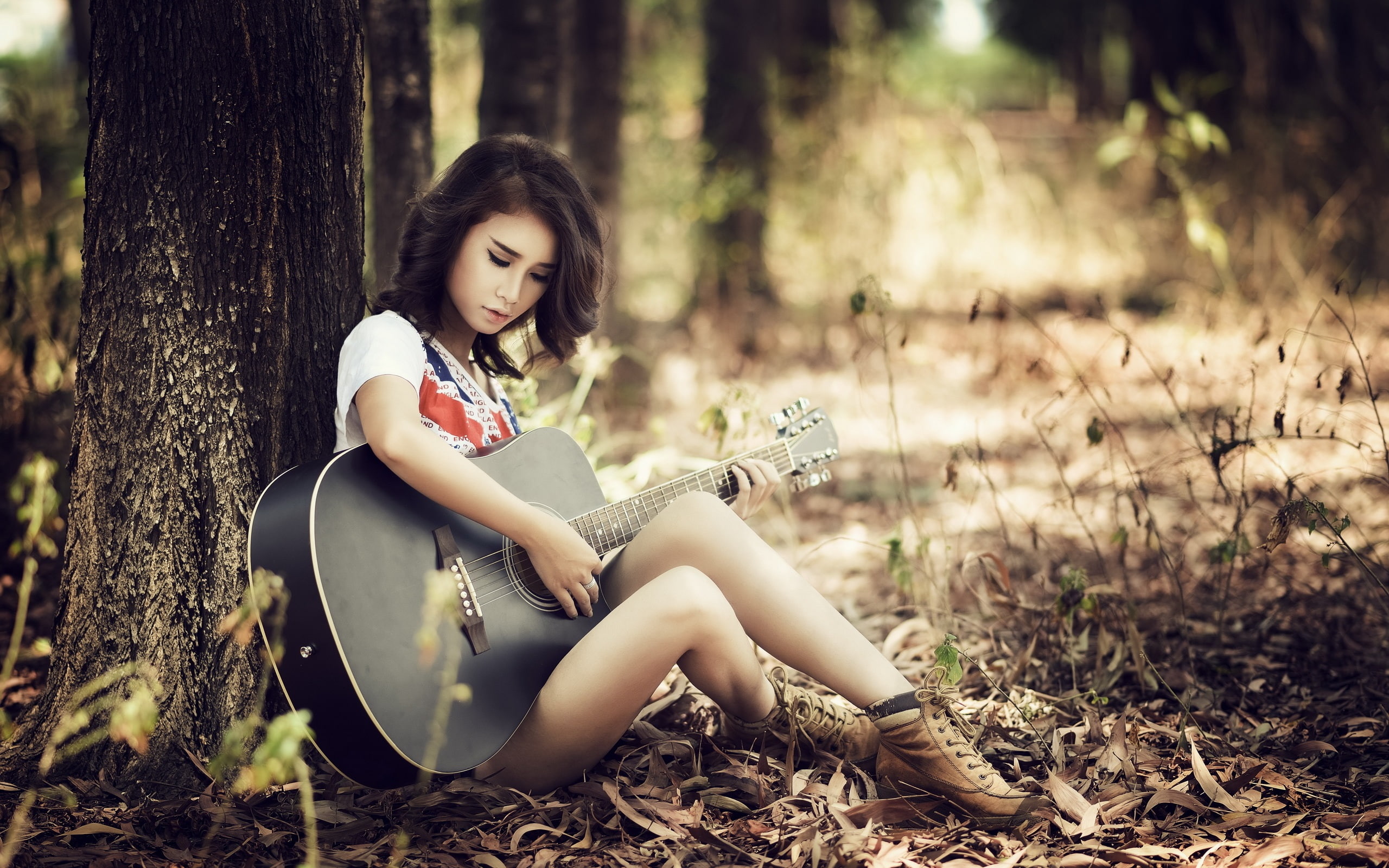 Asian guitar girl, sitting, trees