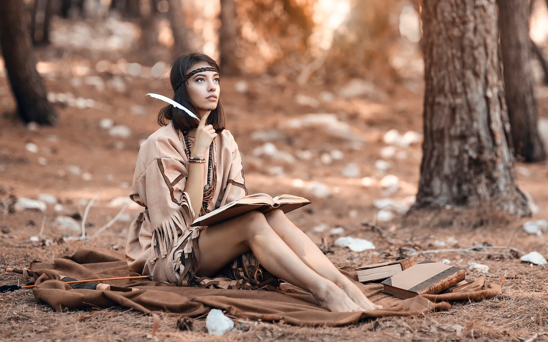 Long hair girl in the forest, reading book