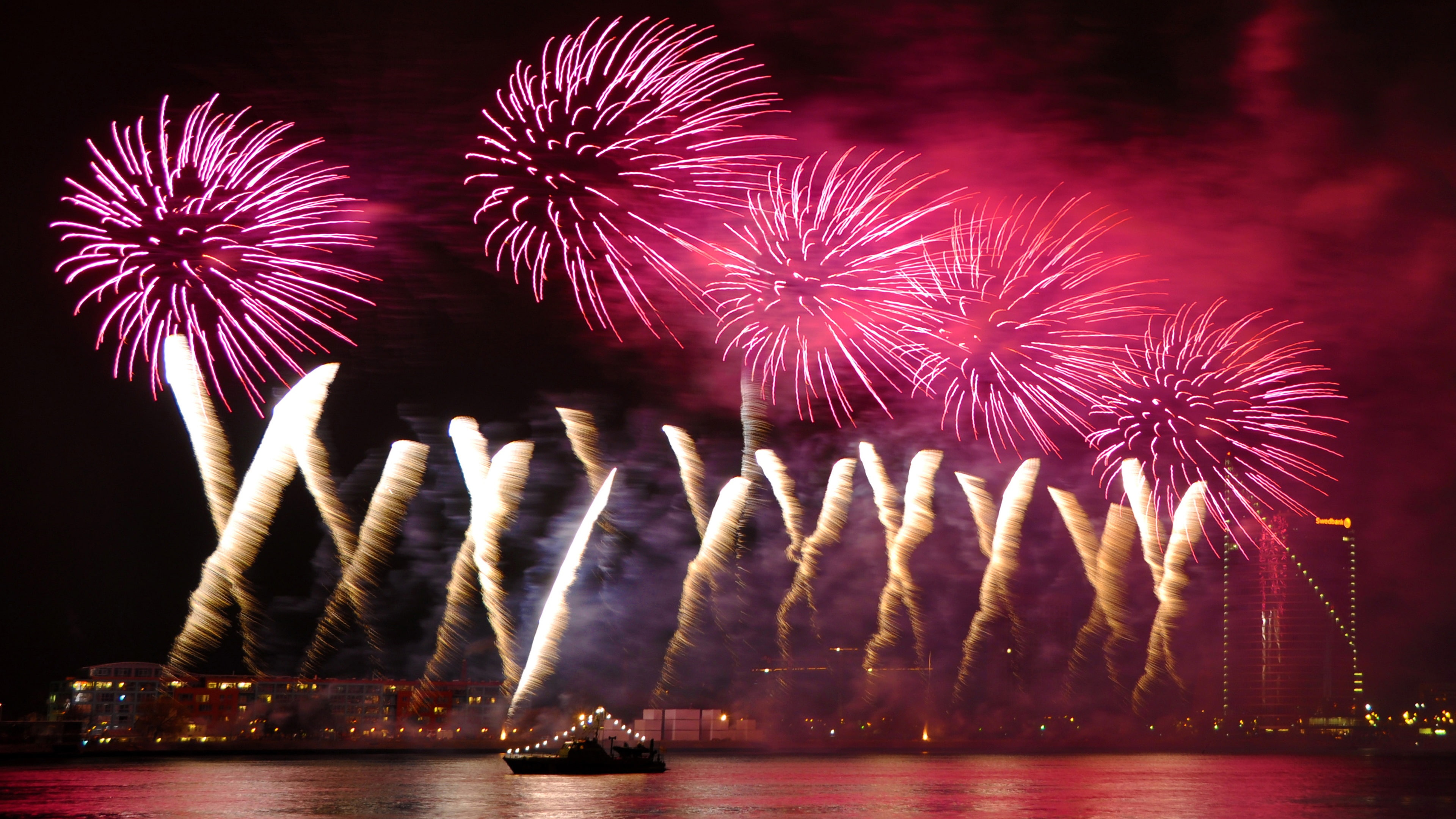 Night city sky, beautiful fireworks, river, purple and orange fireworks display