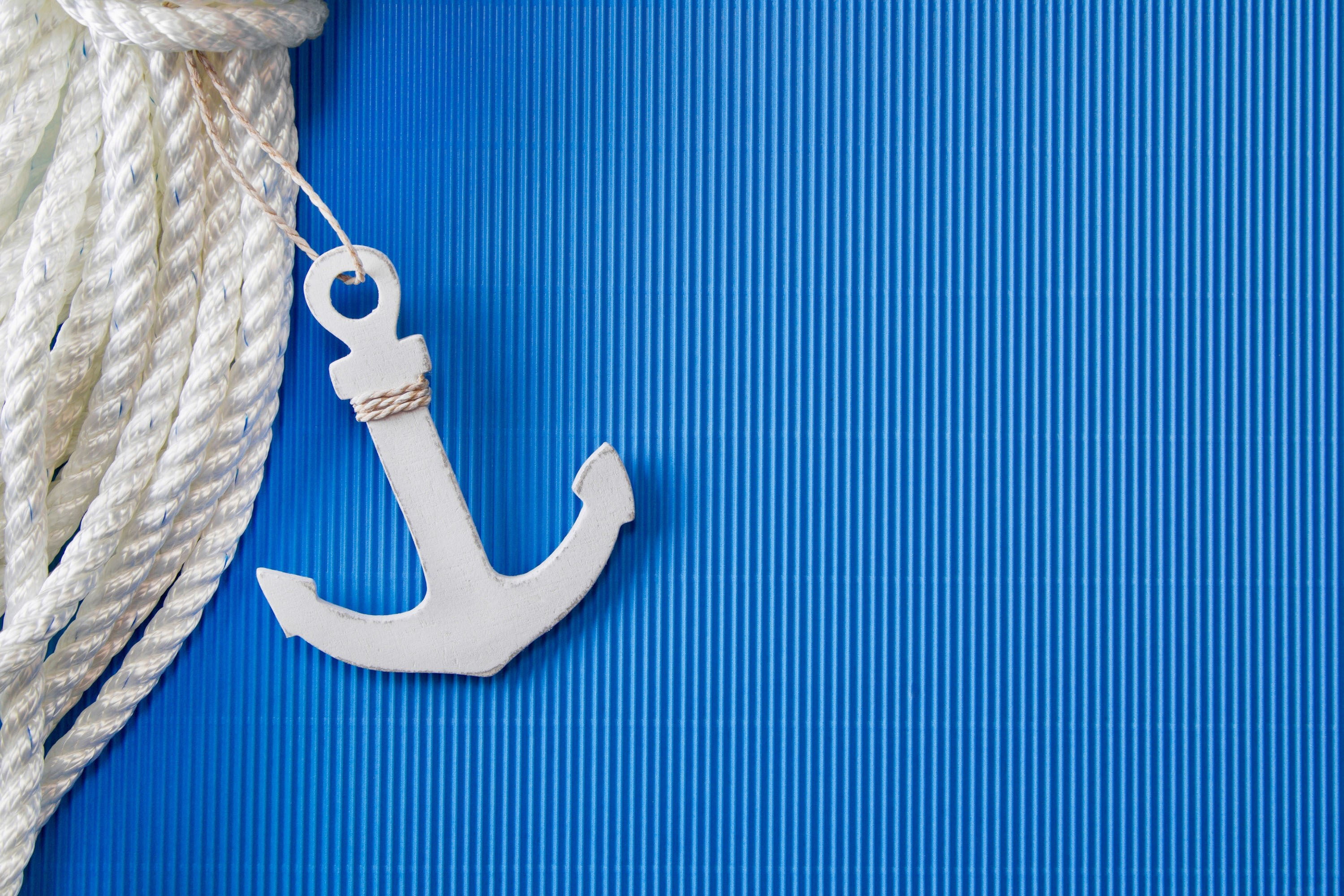 white anchor hanging decor, strip, background, blue, rope, close-up