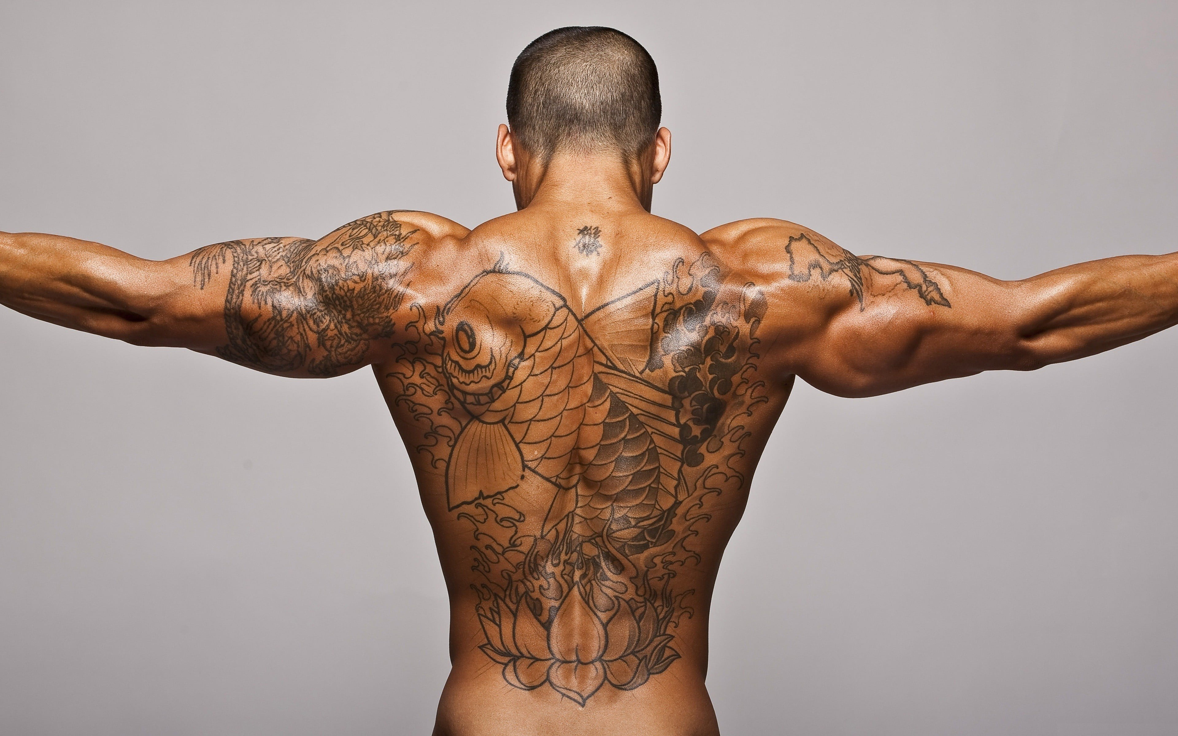 men's black koi fish back tattoo, muscles, gray background, Bodybuilder