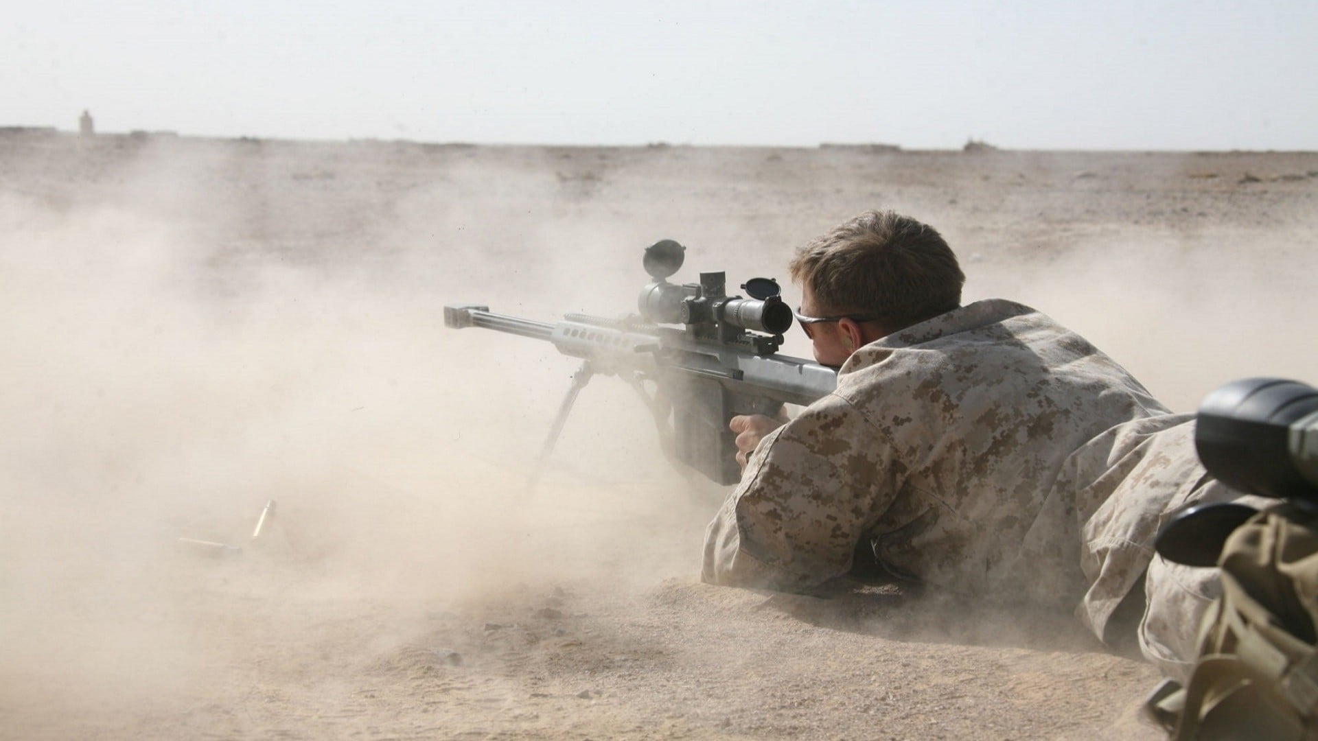 soldier holding black snipe gun, sniper rifle, desert, Barrett .50 Cal