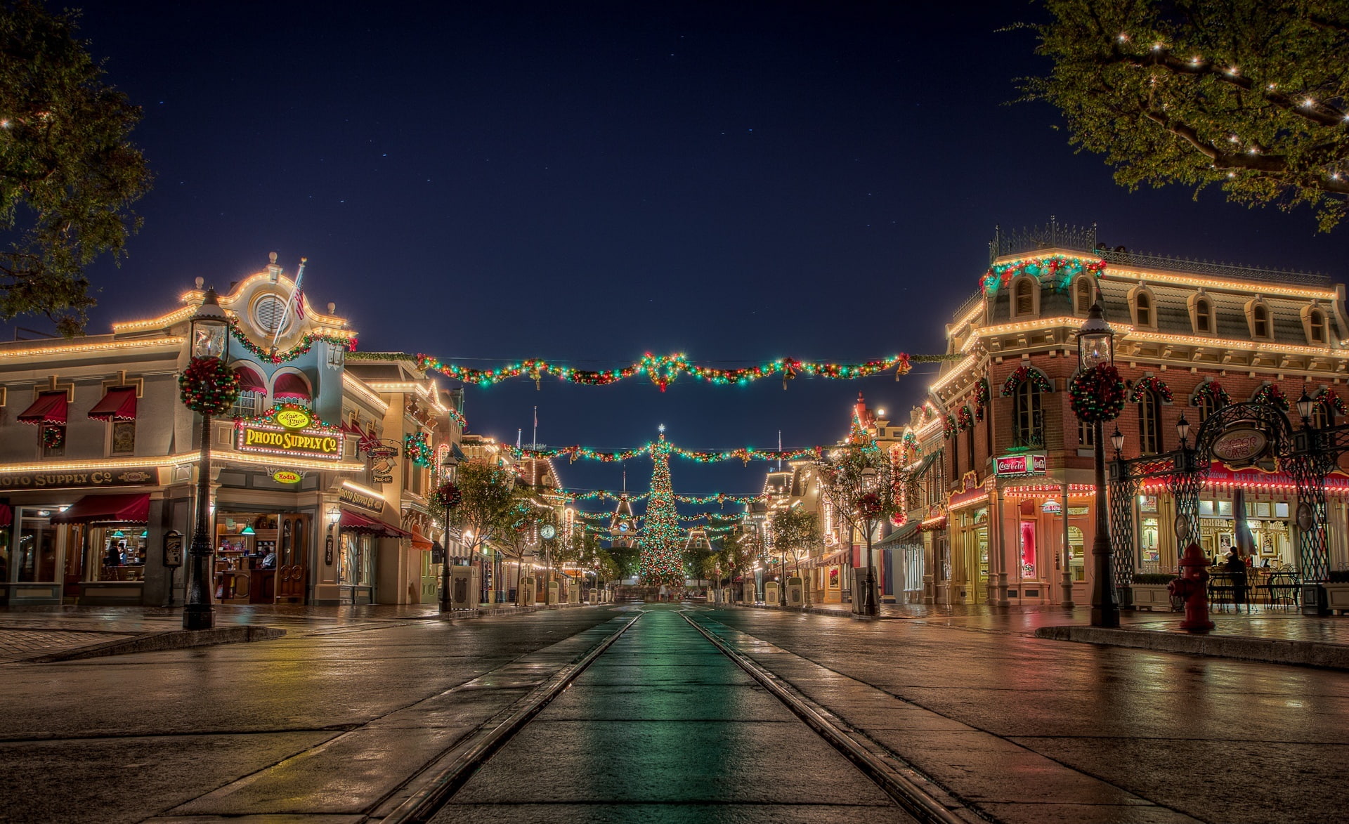 Christmas at Disneyland, photography of assorted-color string lights on buildings