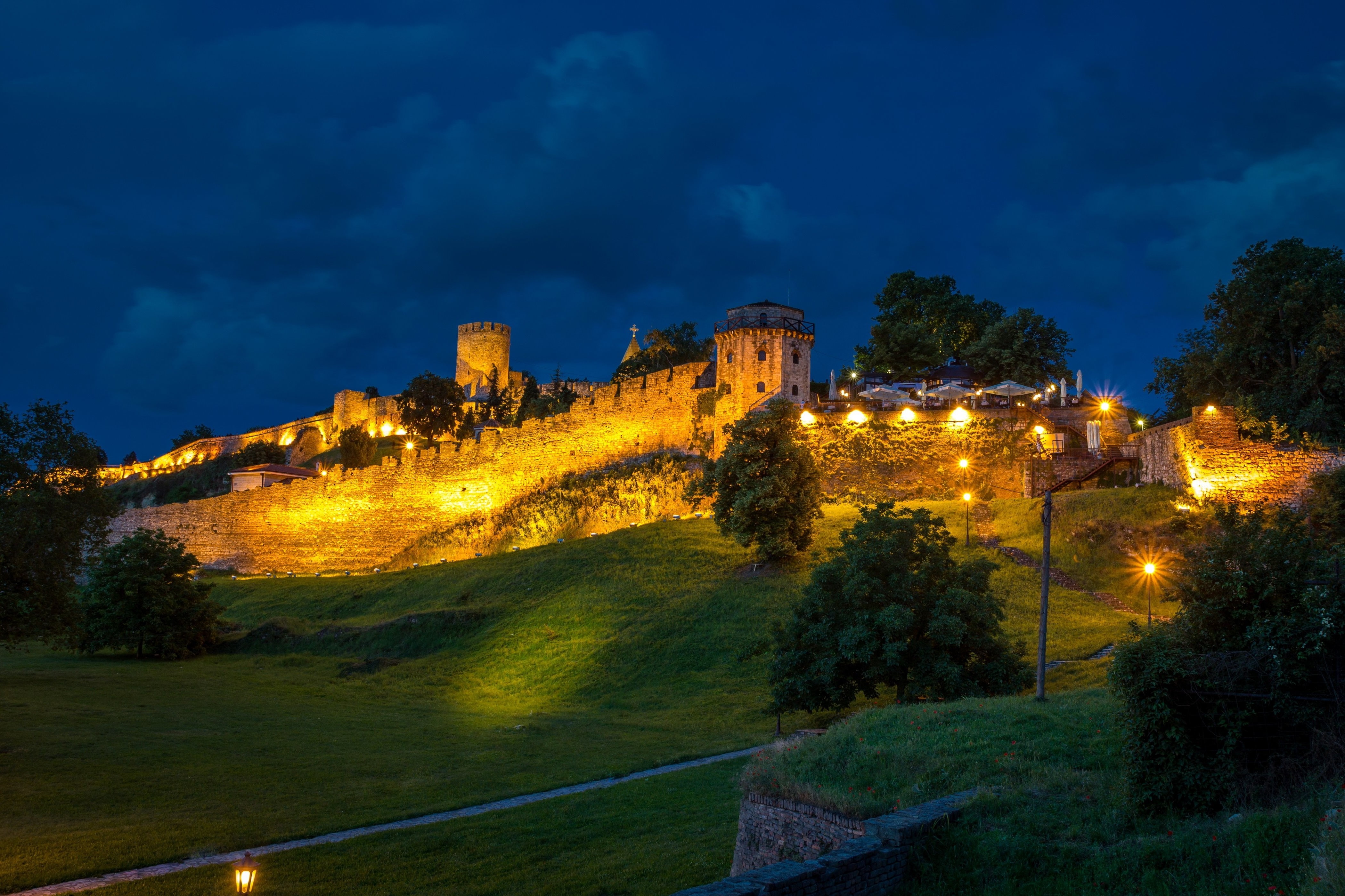 nature landscape architecture castle hill fortress belgrade serbia evening lights grass walls clouds