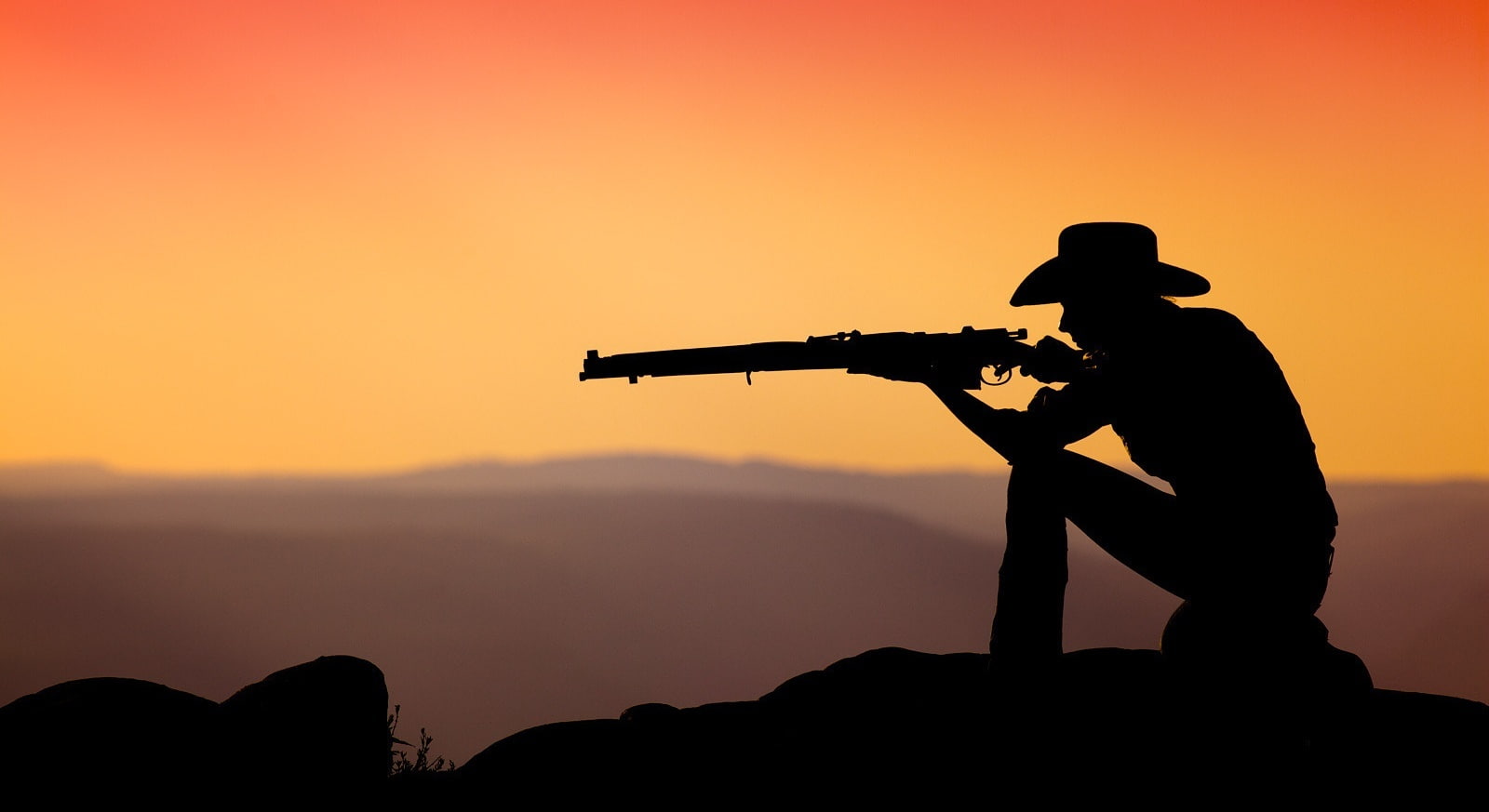 Cowboy Shooting In The Sunset, black hat and hunting rifle, Nature