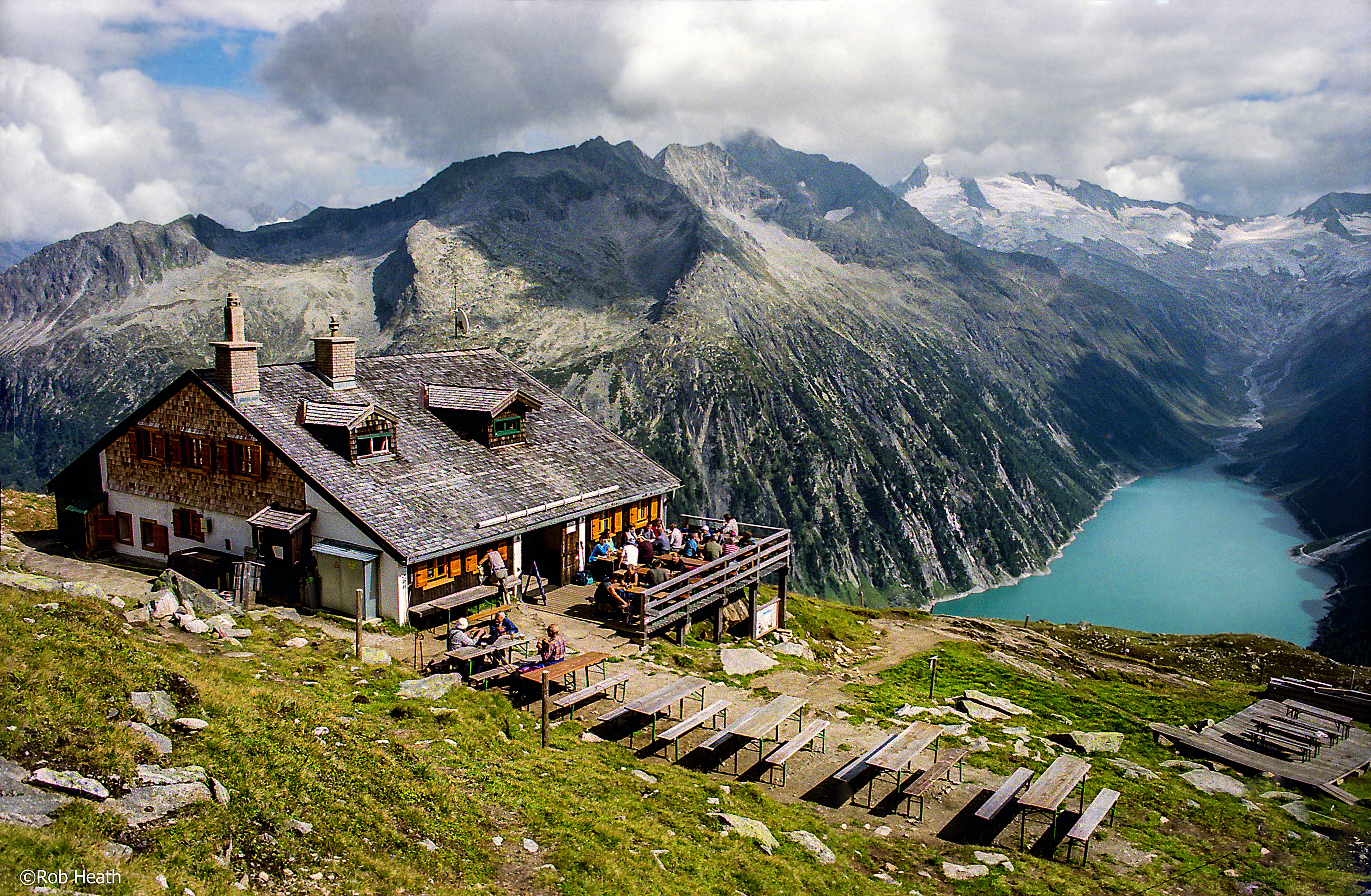 landscape photo of gray concrete house beside mountain, zillertal alps, mayrhofen, zillertal alps, mayrhofen