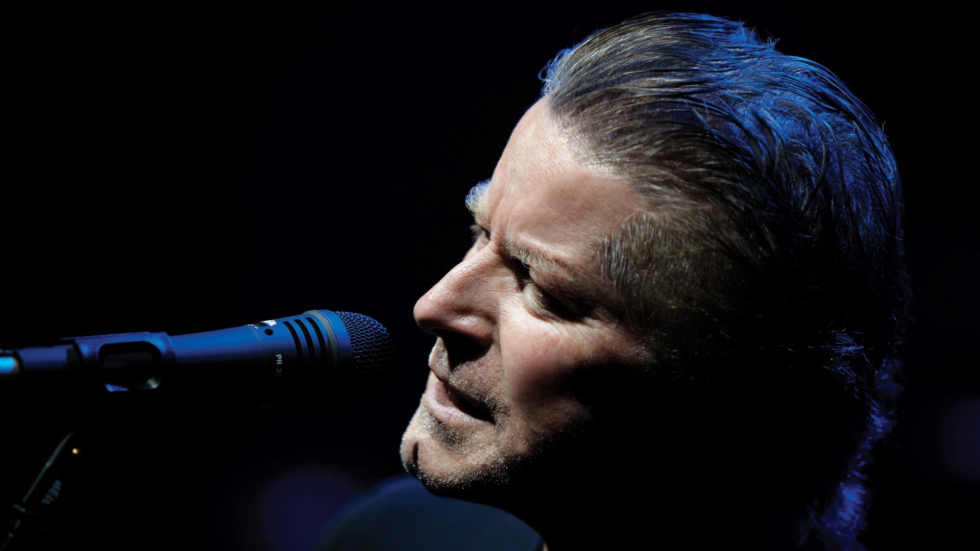 man's face and black microphone, don henley, light, haircut, singer