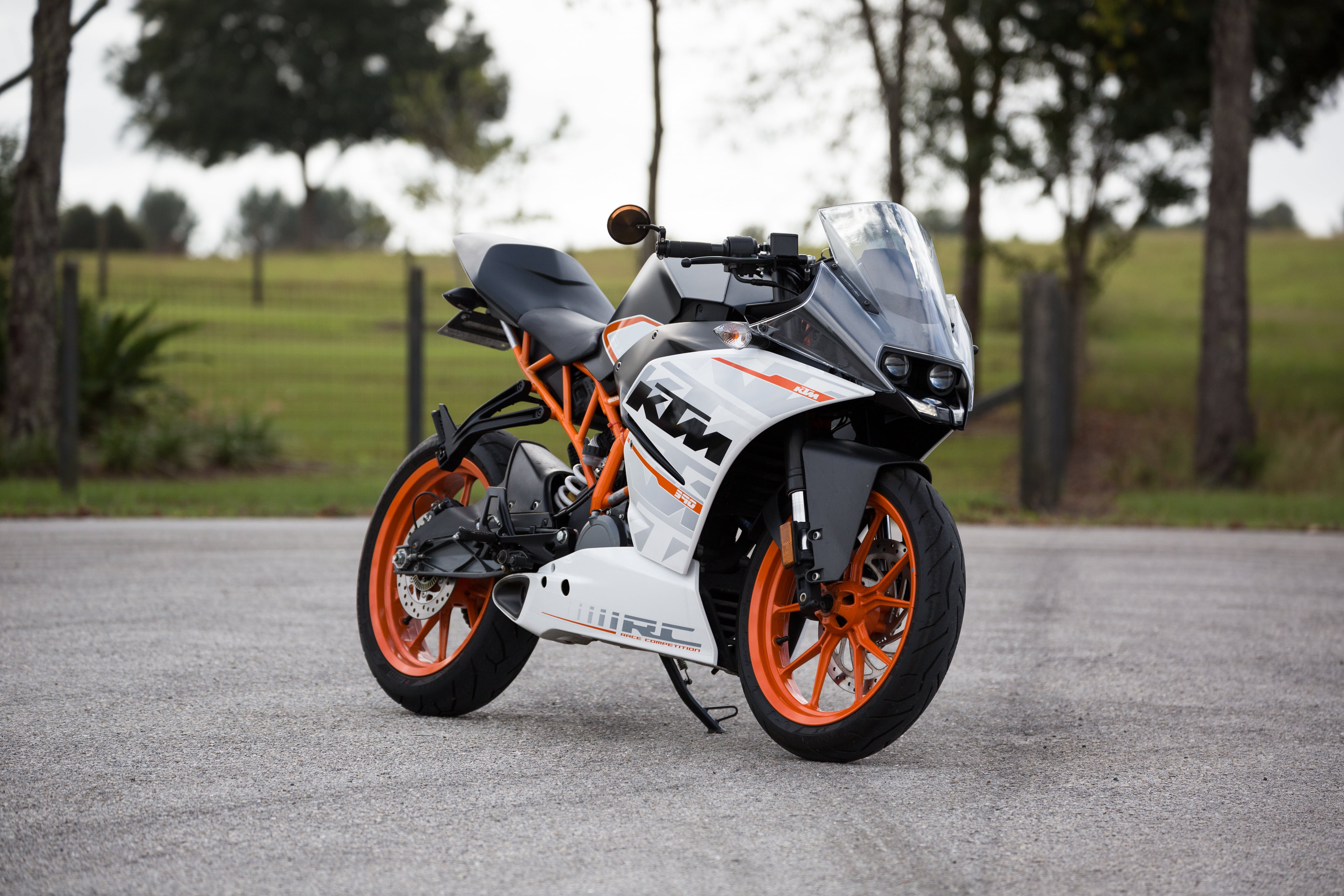 white and black KTM RC sportbike, motorcycle, side view, speed