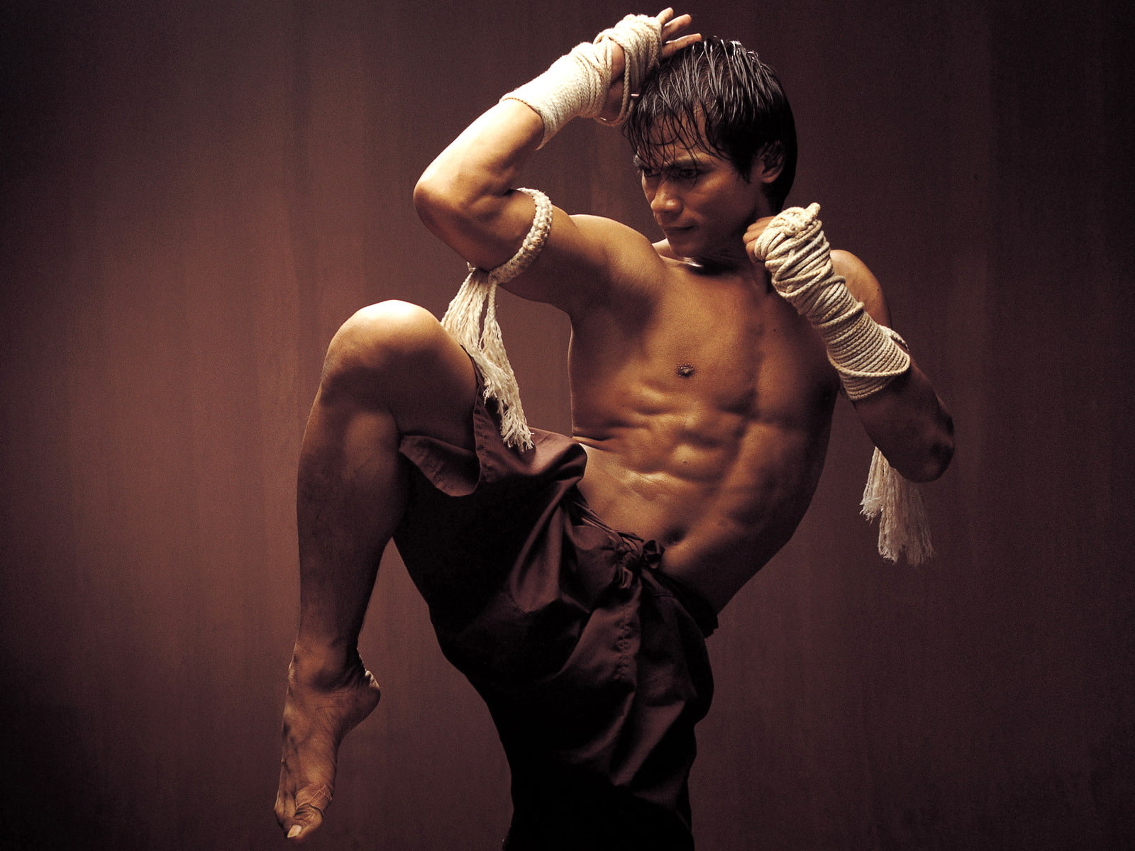 Tony Jaa as Tien of Ong Bak, wall, Thai Boxing, muscular Build