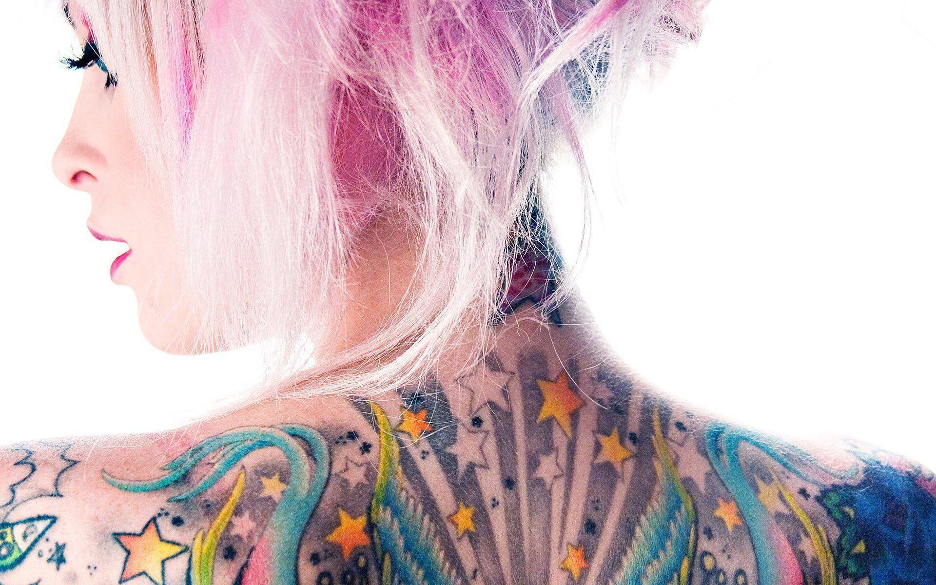 Colorful tattoos and pink hair, woman's back piece tattoo, girls