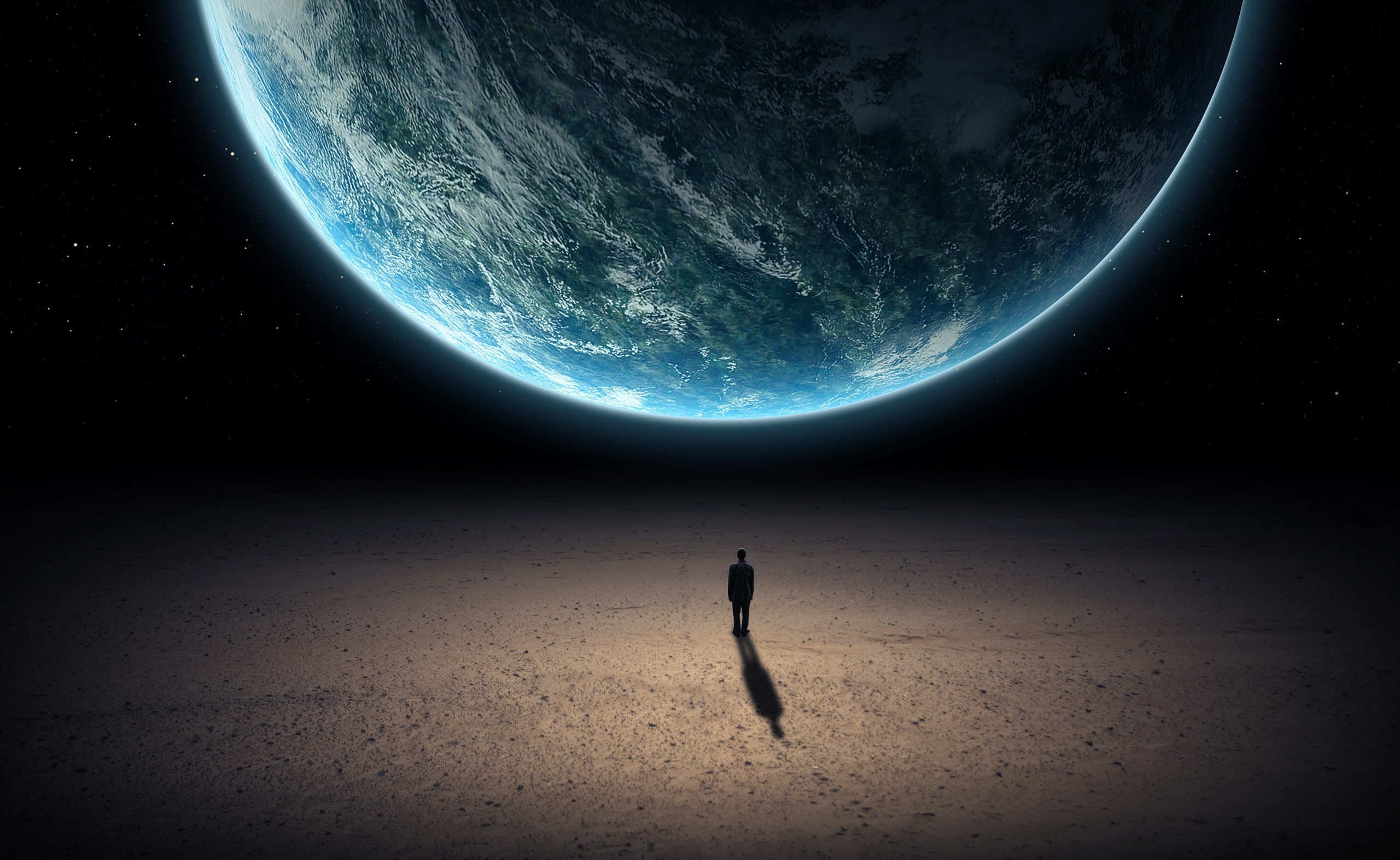 Alone In The Universe, man standing in front of earth wallpaper