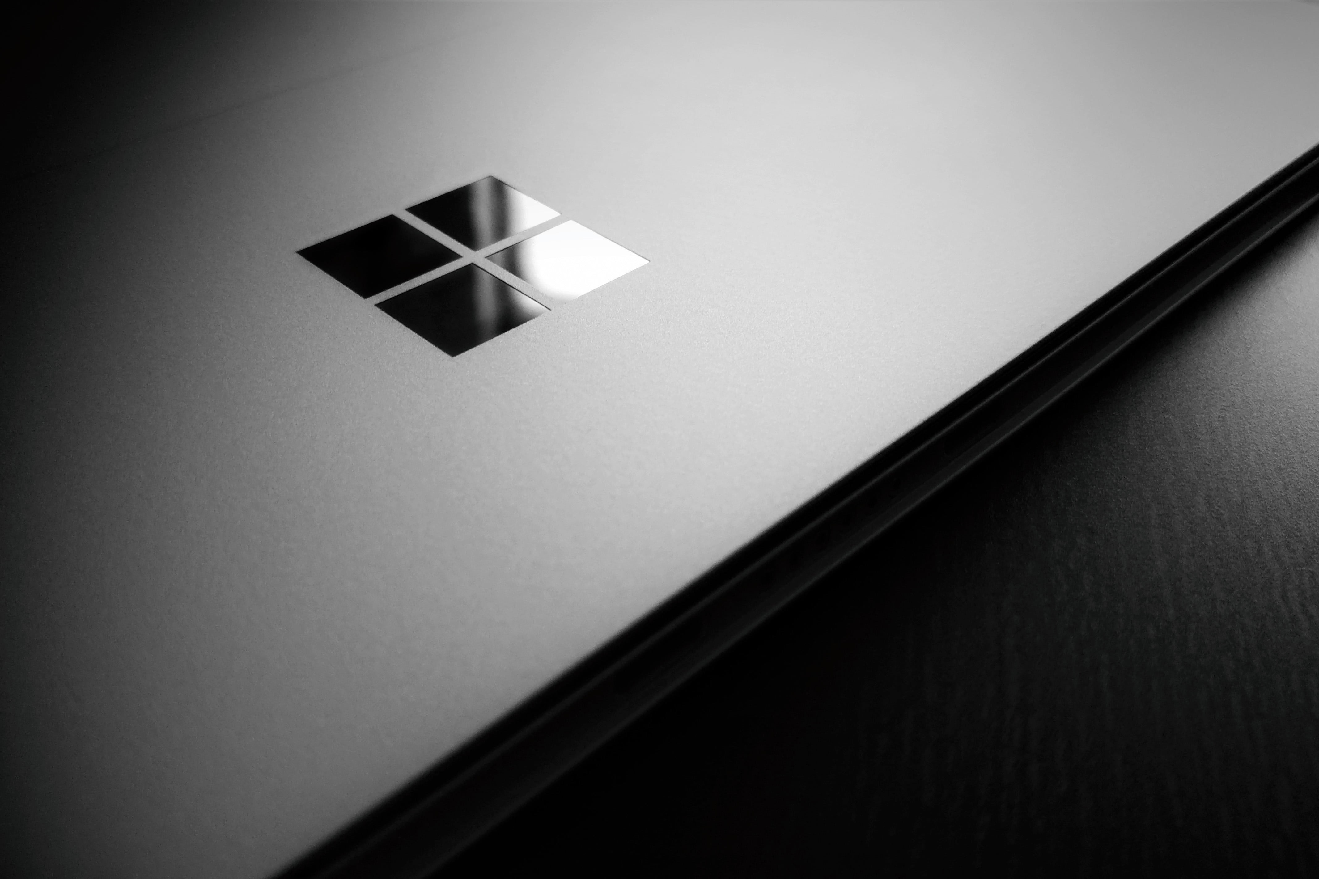 Microsoft Windows logo, Windows 10, wooden surface, laptop, lighting equipment