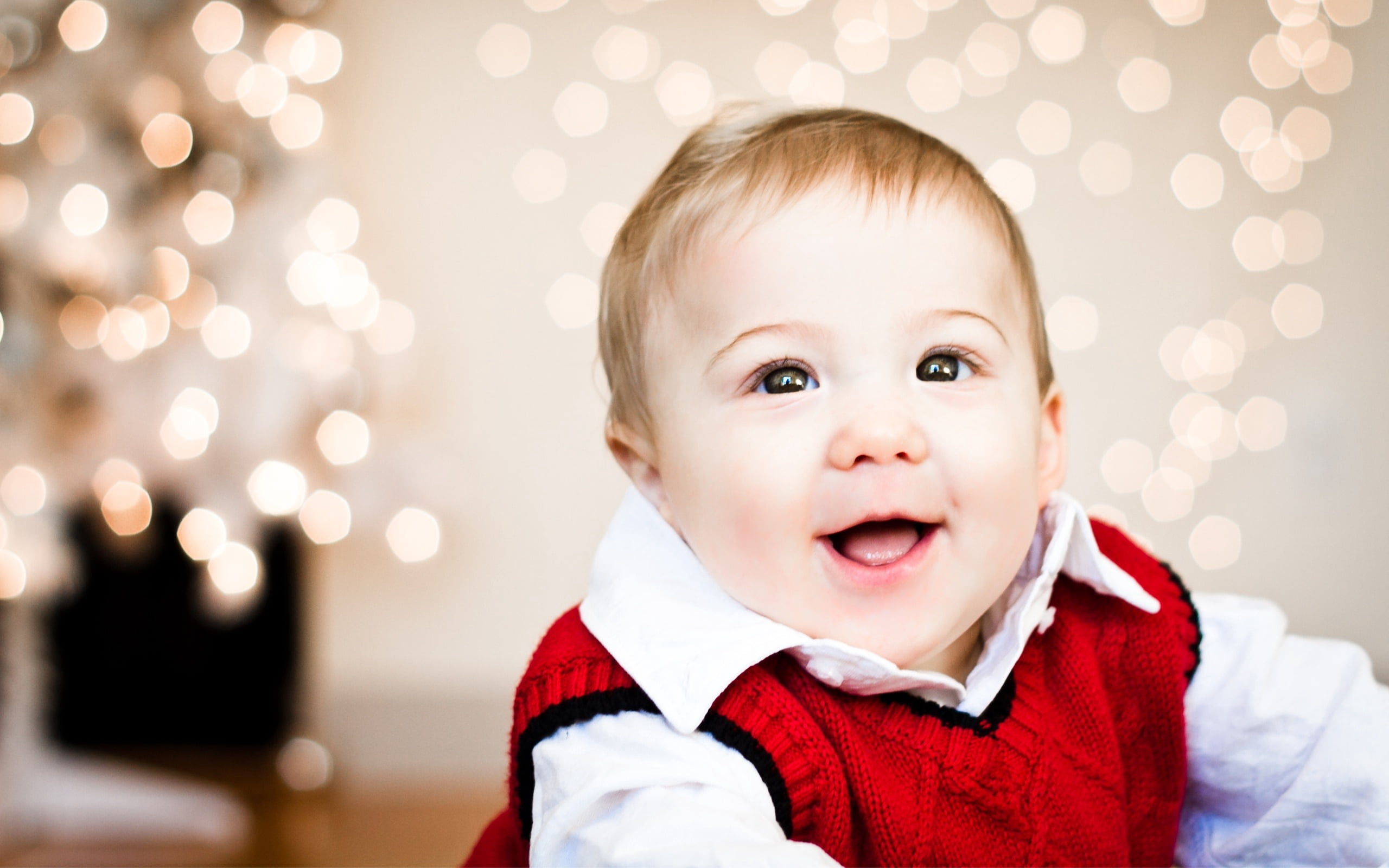 baby's cable knit red sweater vest, face, glare, smile, child
